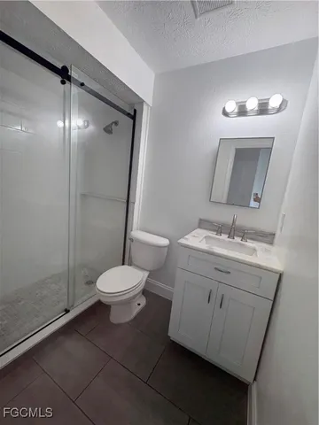 a view of a livingroom with a ceiling fan and window