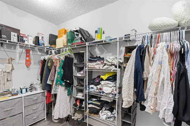 a bathroom with a double vanity sink large mirror and bathtub