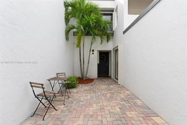 a vase with flowers sitting on a table