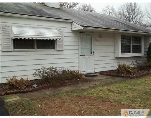 39 Kenmore Road Edison, NJ 08817 - Photo 1 of 6 a view of house with backyard space and garden