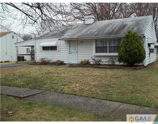 39 Kenmore Road Edison, NJ 08817 - Photo 2 of 6 a front view of a house with a yard