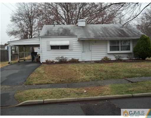 39 Kenmore Road Edison, NJ 08817 - Photo 3 of 6 a front view of a house with a yard