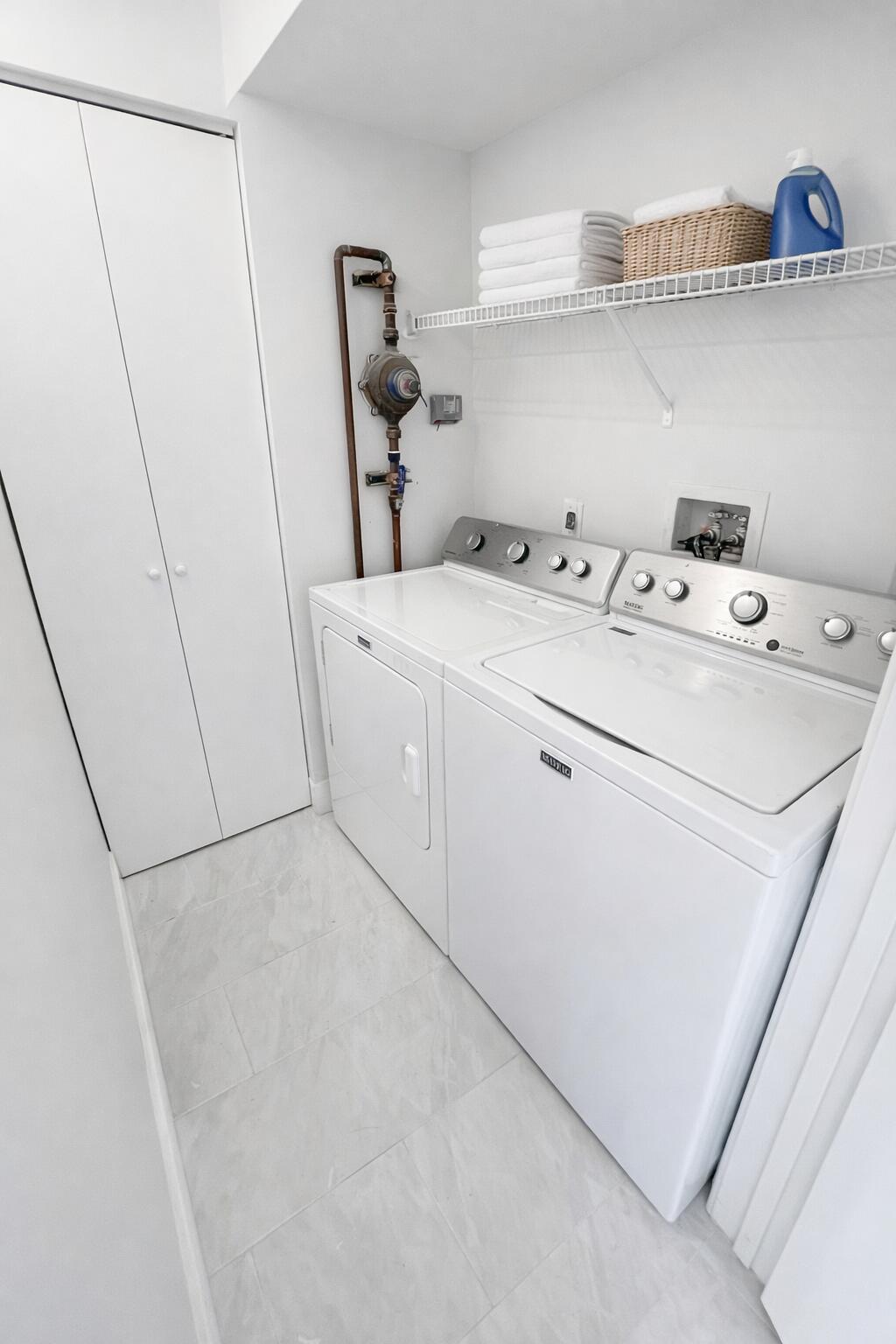9055 Wiles Road, Unit 208 Coral Springs, FL 33067 - Photo 11 of 35 a utility room with dryer and washer