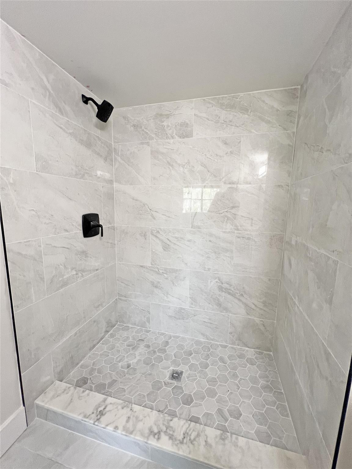 9055 Wiles Road, Unit 208 Coral Springs, FL 33067 - Photo 13 of 35 a bathroom with a shower