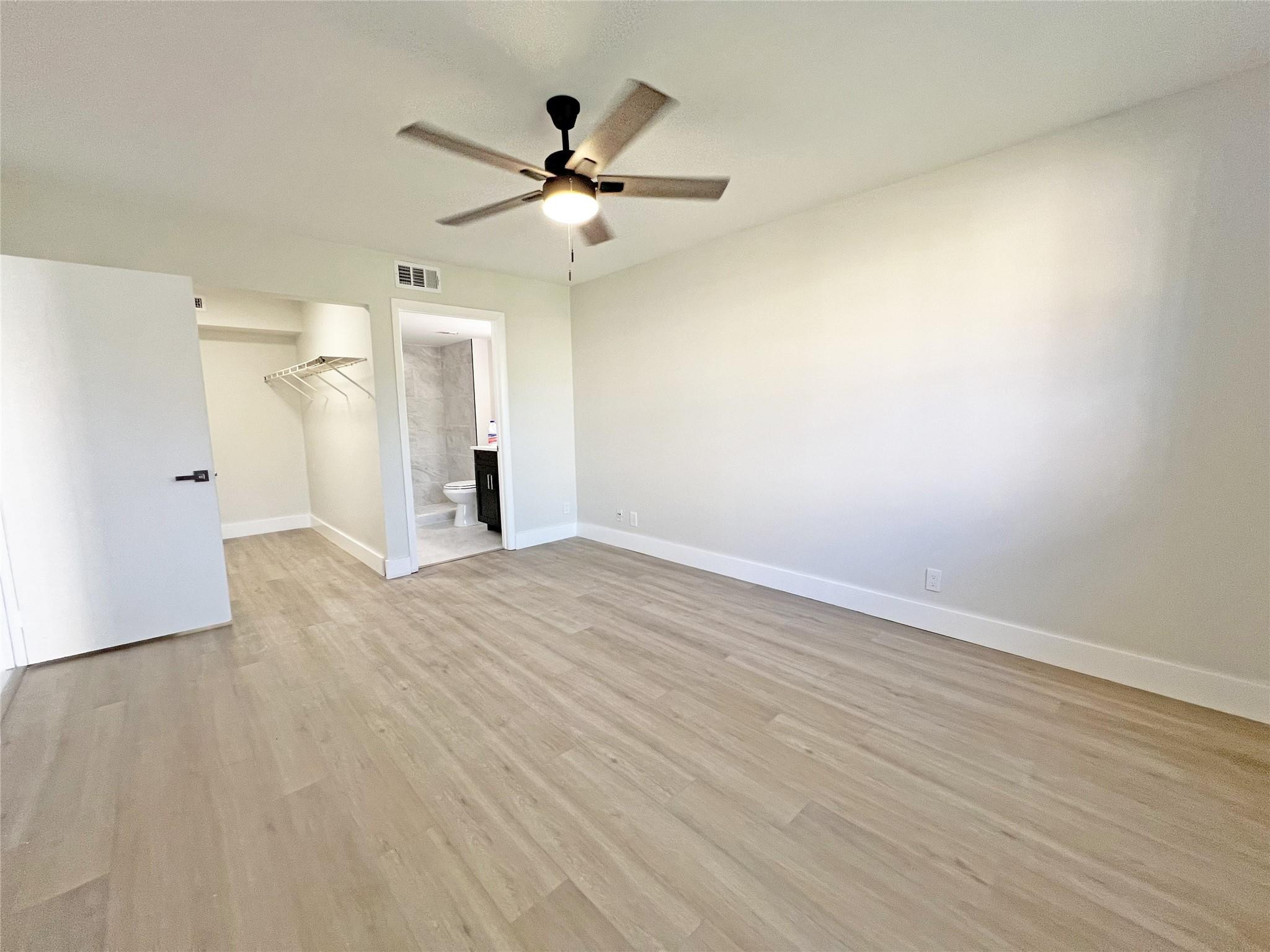 9055 Wiles Road, Unit 208 Coral Springs, FL 33067 - Photo 15 of 35 wooden floor in an empty room
