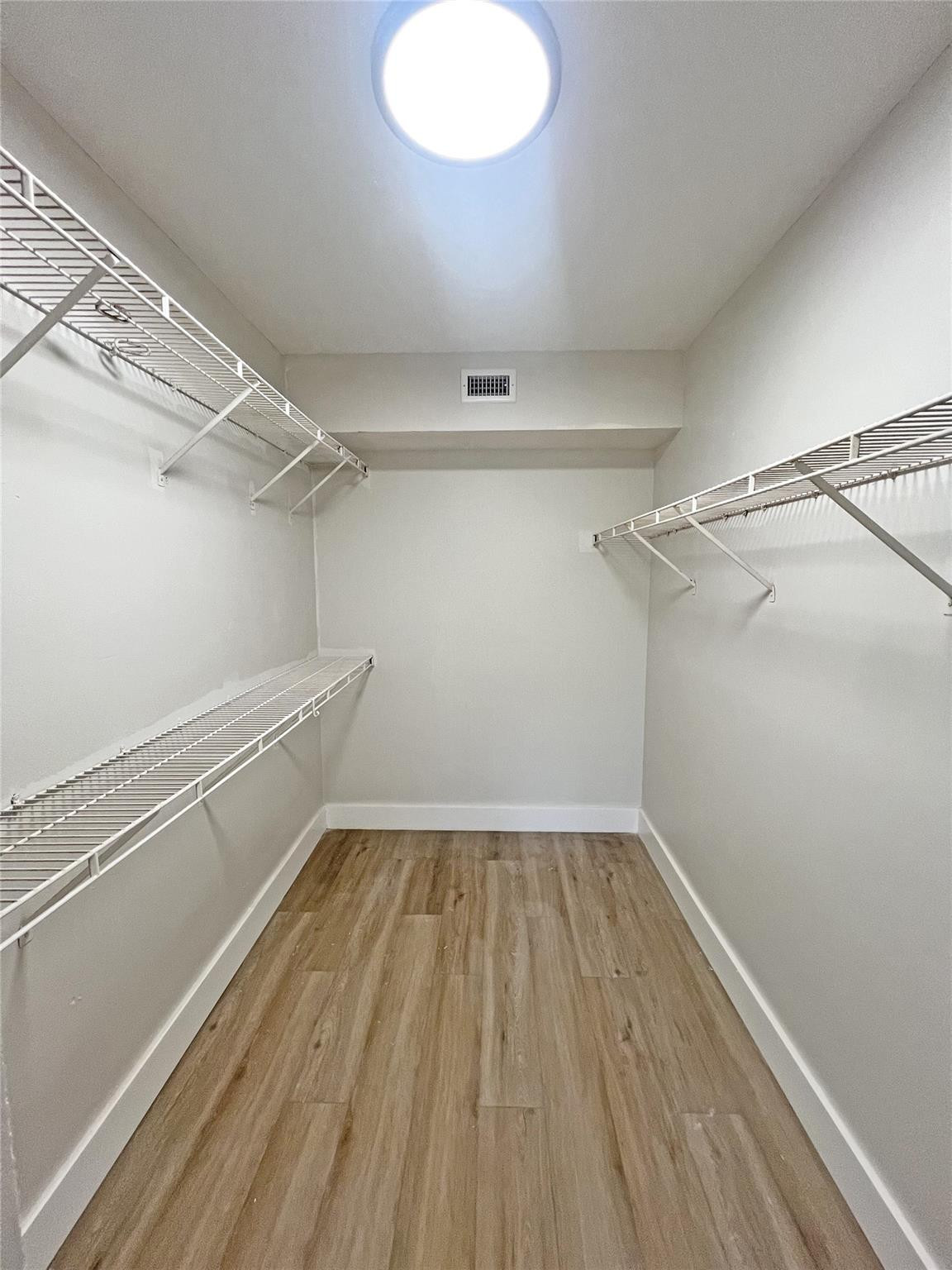 9055 Wiles Road, Unit 208 Coral Springs, FL 33067 - Photo 17 of 35 a view of a room with racks on the wall