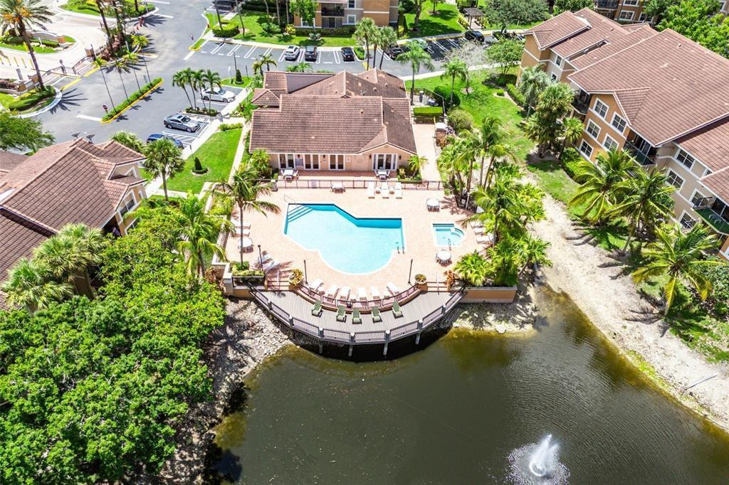 9055 Wiles Road, Unit 208 Coral Springs, FL 33067 - Photo 26 of 35 an aerial view of a house with a garden and lake view