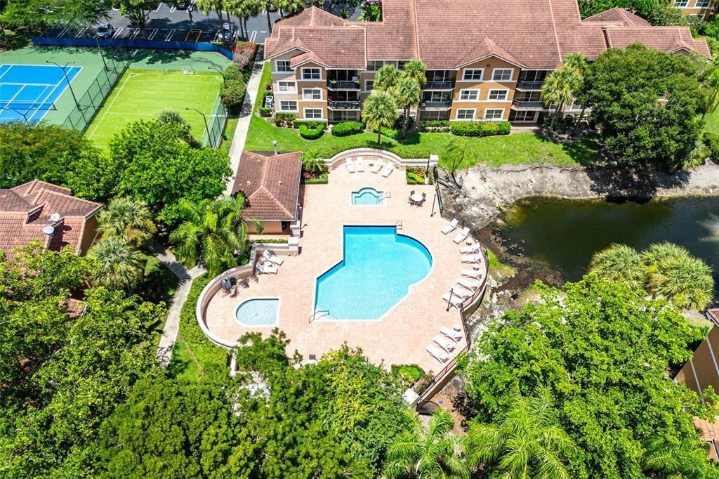 9055 Wiles Road, Unit 208 Coral Springs, FL 33067 - Photo 27 of 35 an aerial view of a house with a garden and lake view