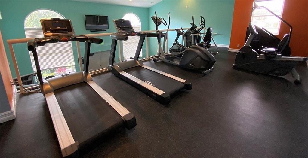 9055 Wiles Road, Unit 208 Coral Springs, FL 33067 - Photo 29 of 35 a view of a room with gym equipment