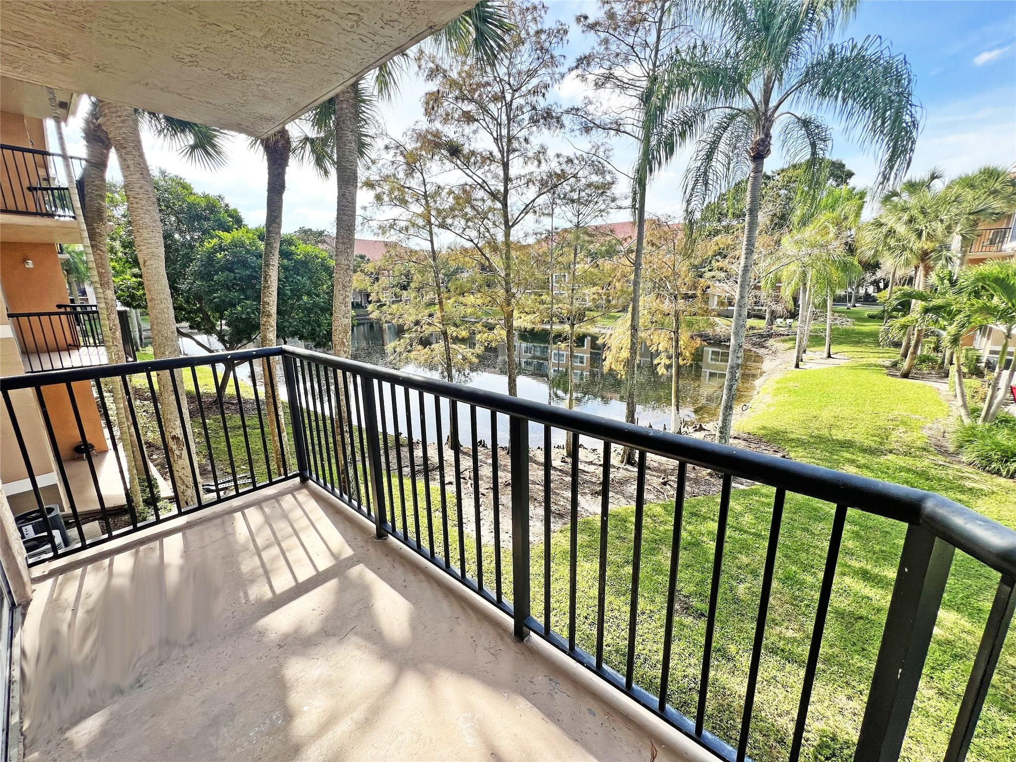 9055 Wiles Road, Unit 208 Coral Springs, FL 33067 - Photo 9 of 35 a view of balcony with furniture