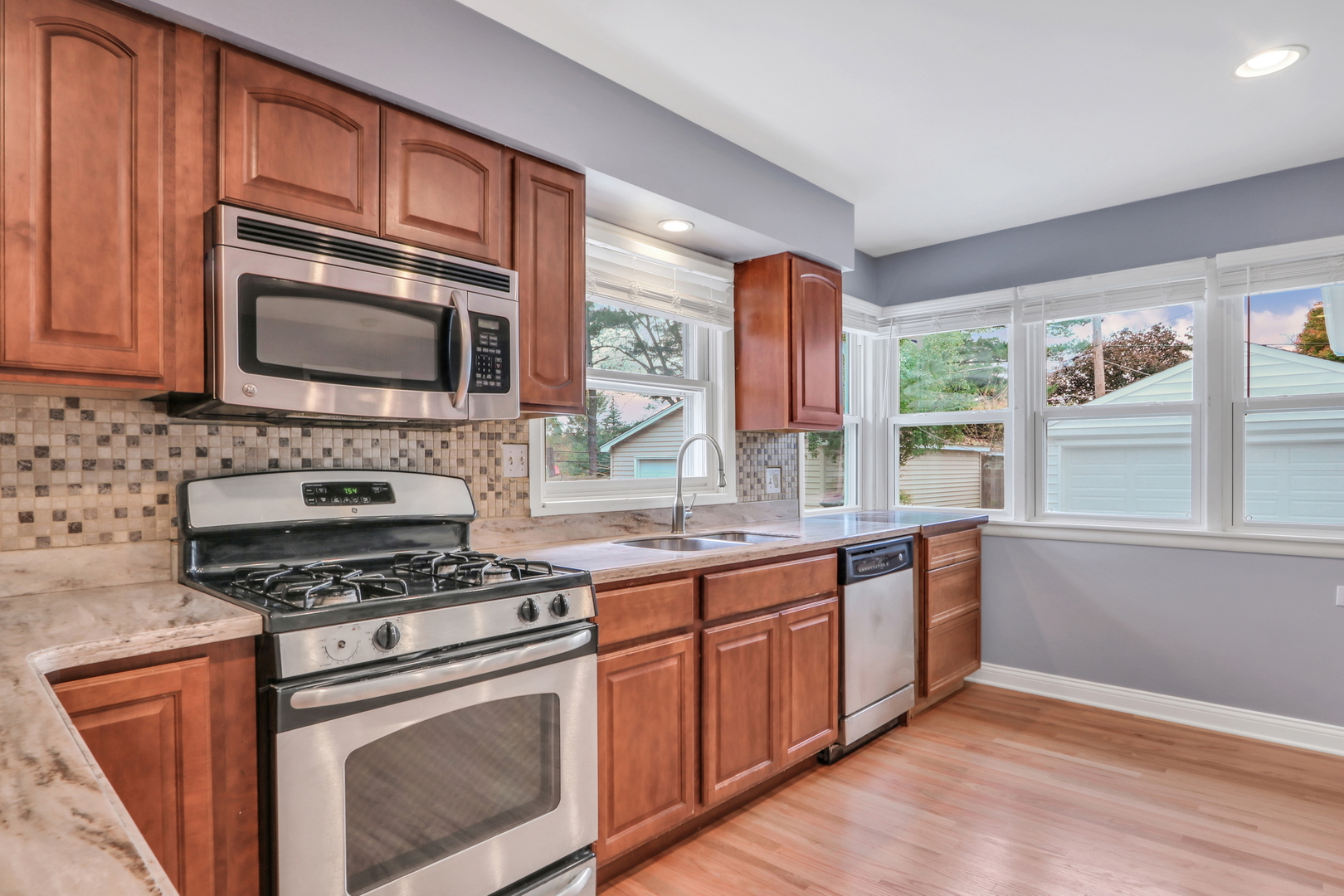 1186 Highland Road Mundelein, IL 60060 - Photo 11 of 28 a kitchen with stainless steel appliances a stove sink and microwave