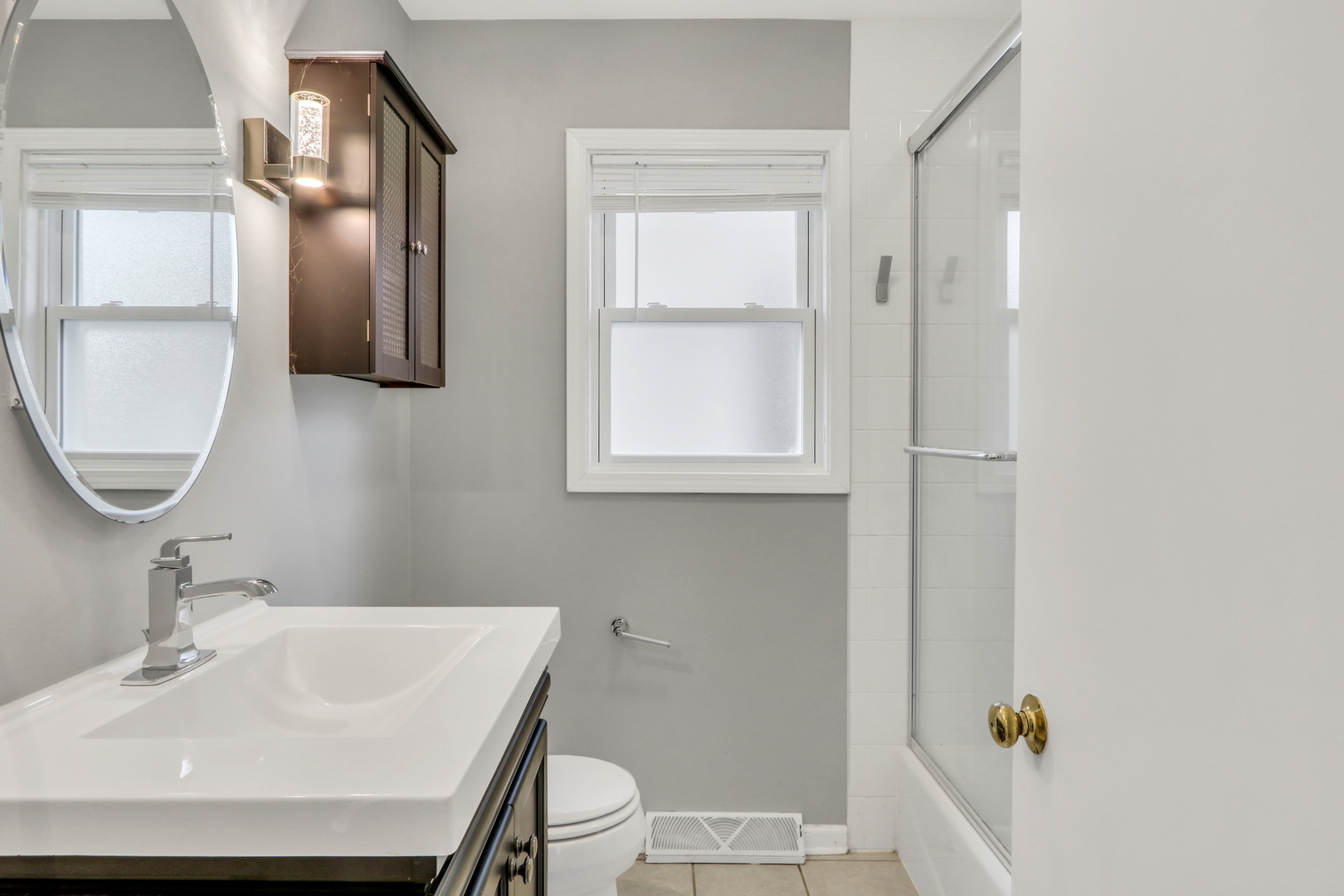 1186 Highland Road Mundelein, IL 60060 - Photo 20 of 28 a bathroom with a sink toilet and mirror