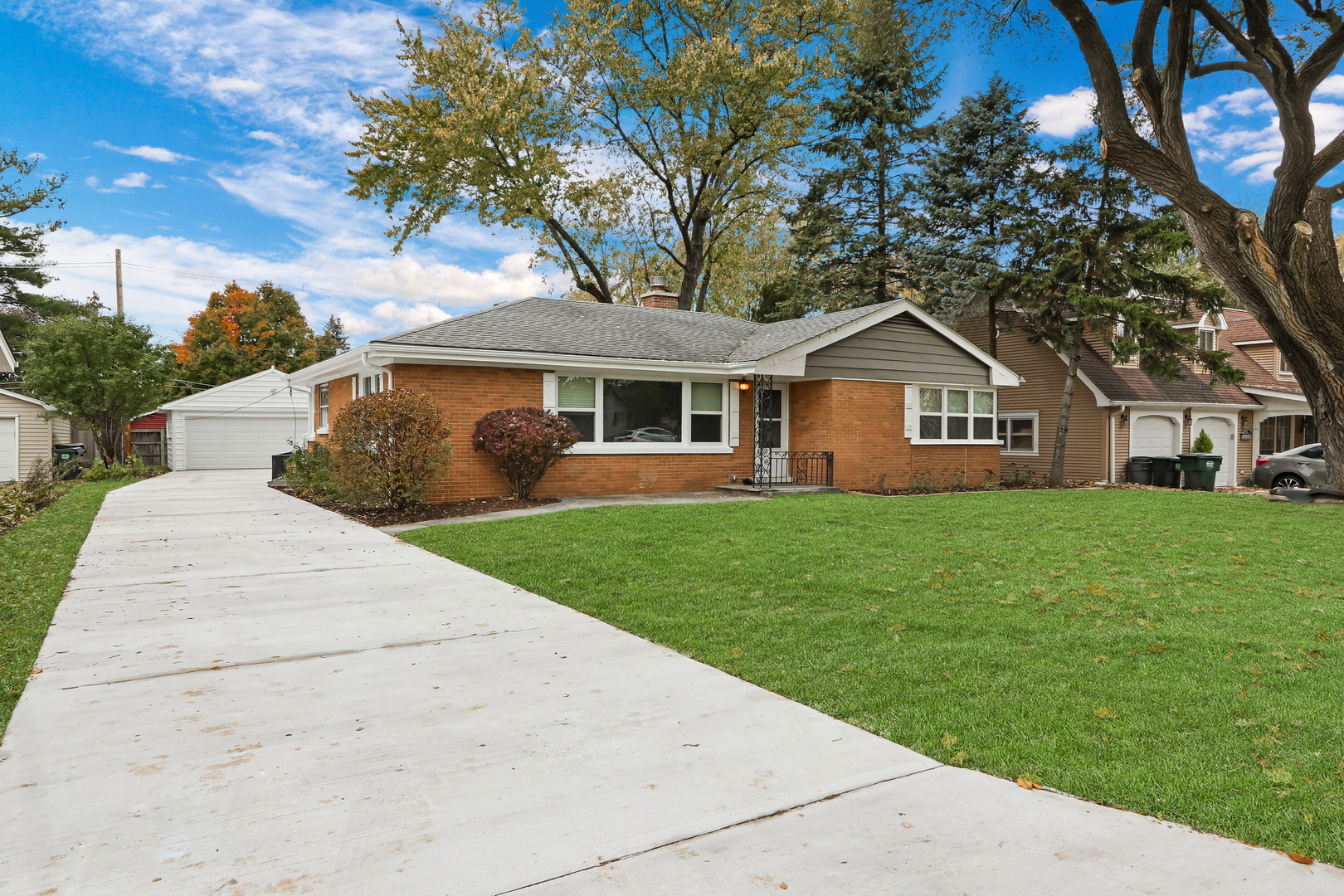 1186 Highland Road Mundelein, IL 60060 - Photo 2 of 28 a front view of a house with a yard