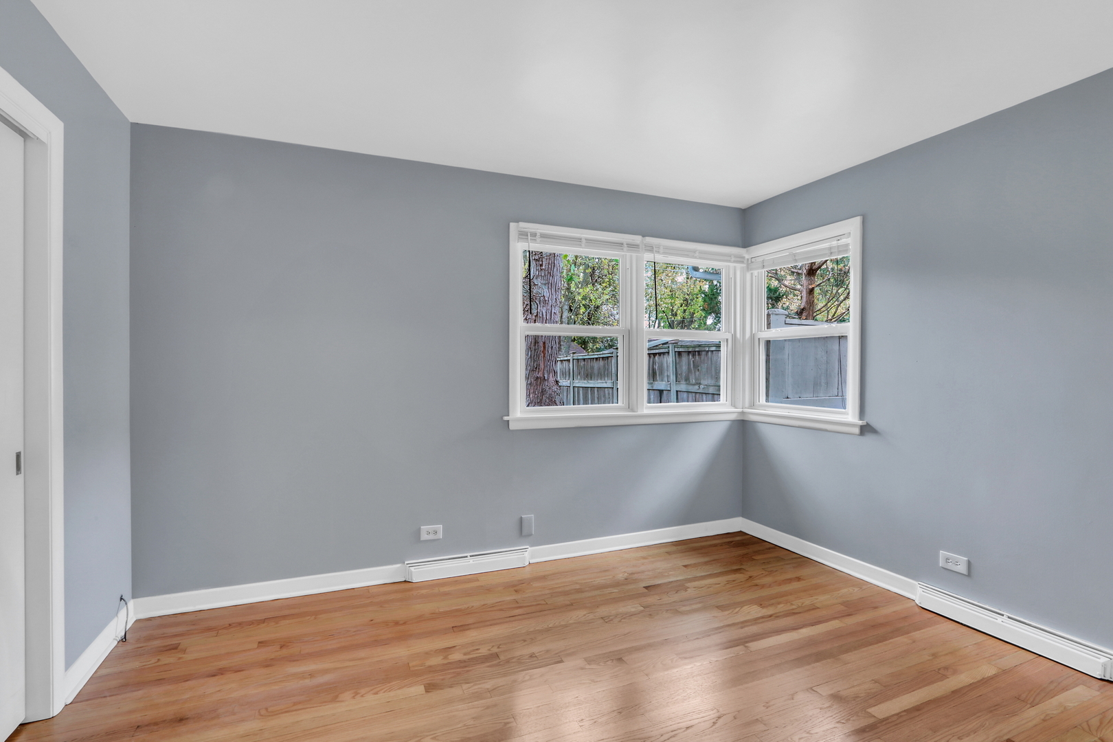 1186 Highland Road Mundelein, IL 60060 - Photo 21 of 28 a view of empty room with wooden floor and fan