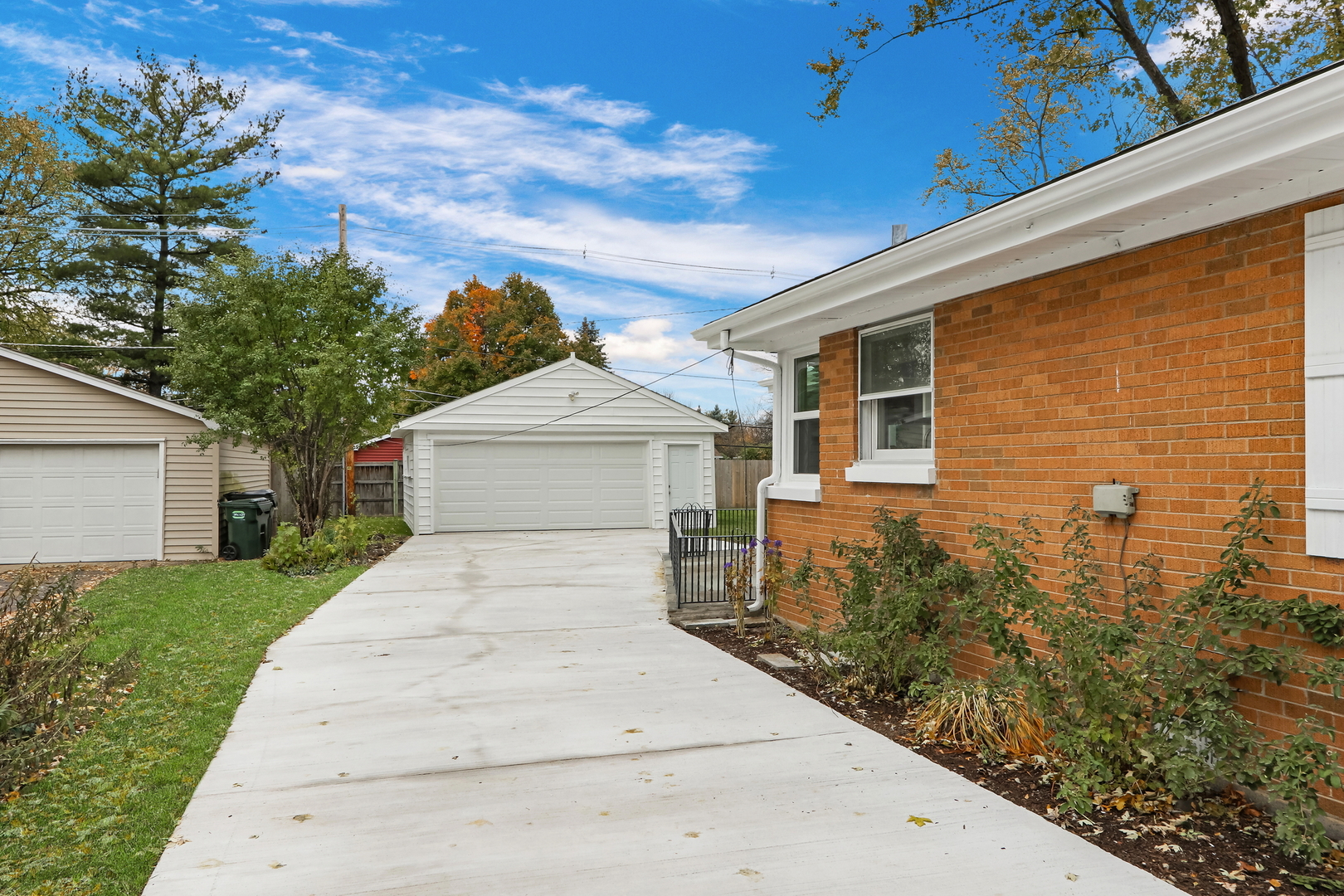 1186 Highland Road Mundelein, IL 60060 - Photo 28 of 28 a front view of a house with a yard and garage
