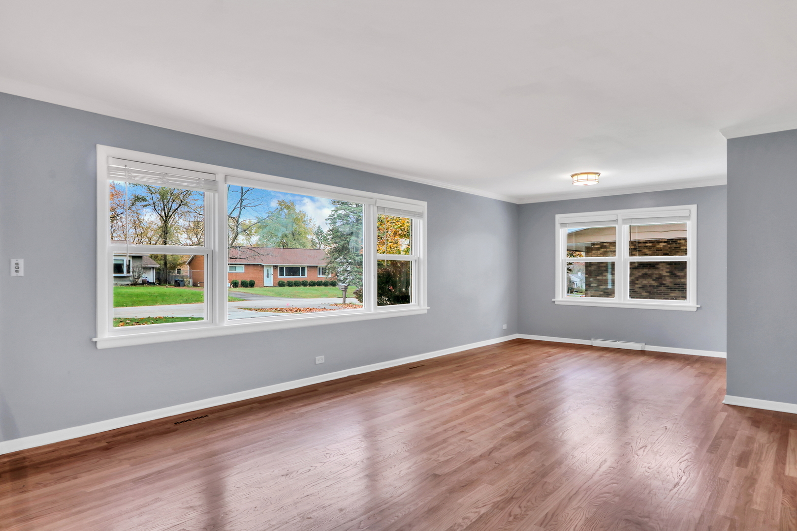 1186 Highland Road Mundelein, IL 60060 - Photo 4 of 28 a view of an empty room with wooden floor and a window