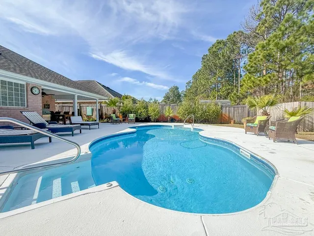 a view of a swimming pool with an outdoor space