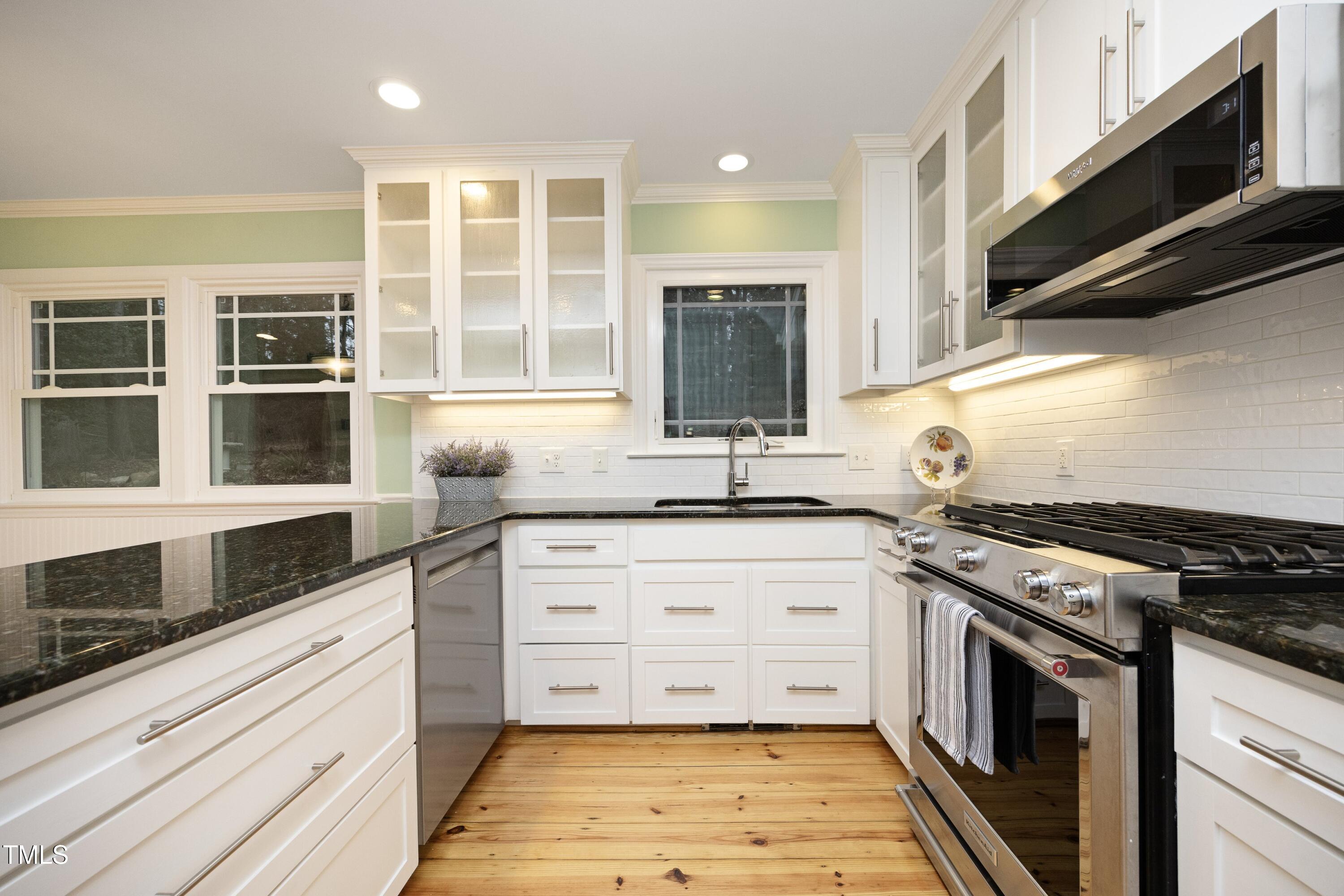 4616 Oak Park Road Raleigh, NC 27612 - Photo 17 of 63 Lower cabinets with convenient pull-out drawers