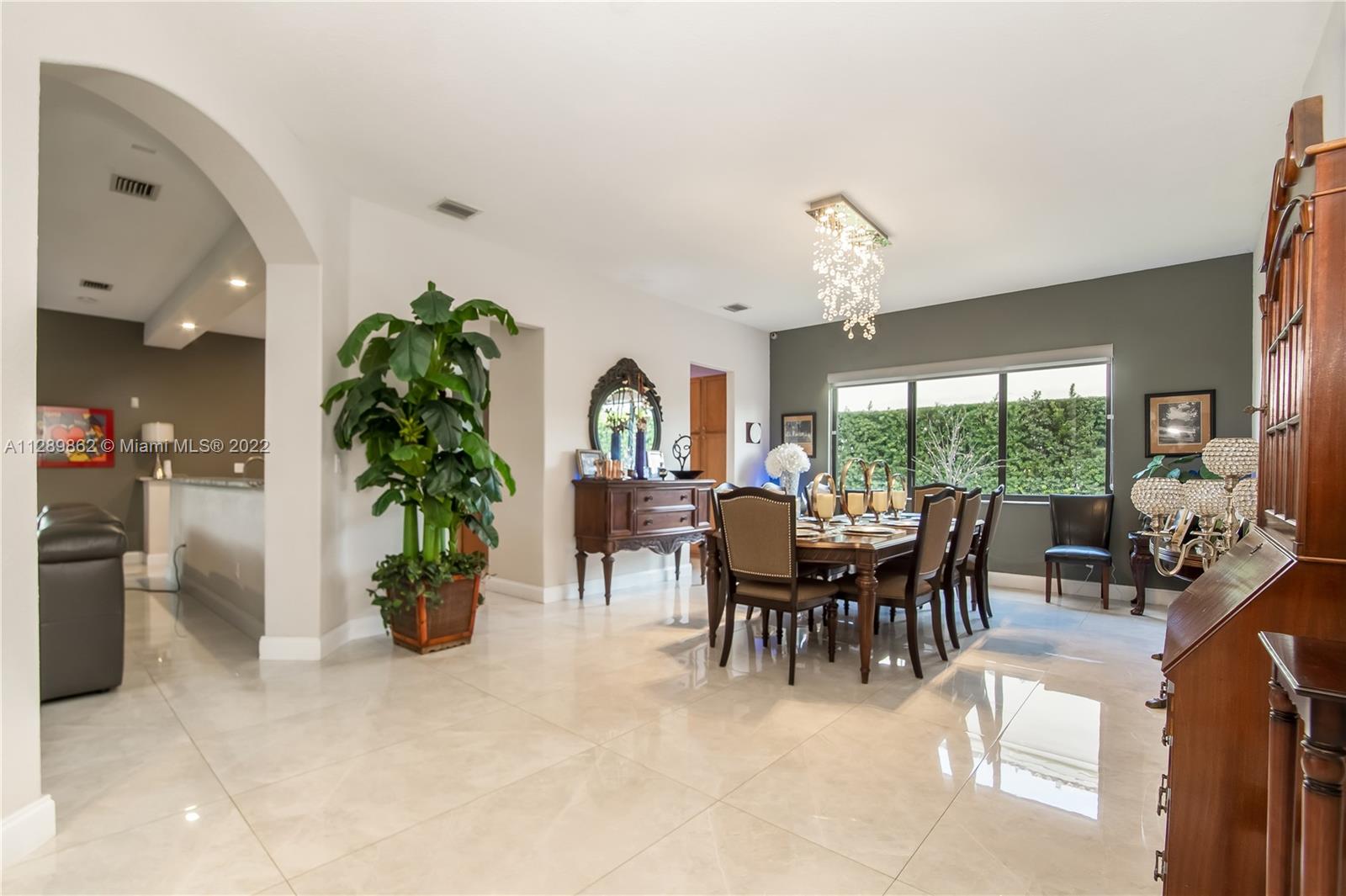 7783 Southwest 188th Street Cutler Bay, FL 33157 - Photo 17 of 70 a view of a dining room with furniture window and outside view