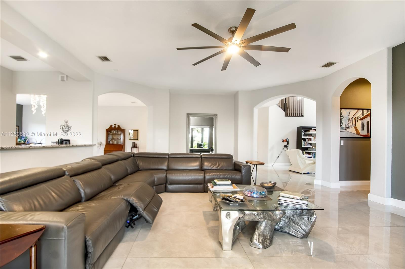 7783 Southwest 188th Street Cutler Bay, FL 33157 - Photo 24 of 70 a living room with furniture and wooden floor