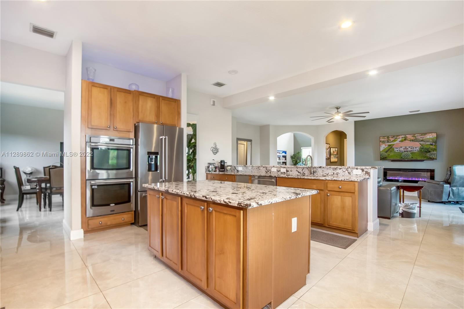 7783 Southwest 188th Street Cutler Bay, FL 33157 - Photo 27 of 70 a kitchen with stainless steel appliances granite countertop a sink and cabinets