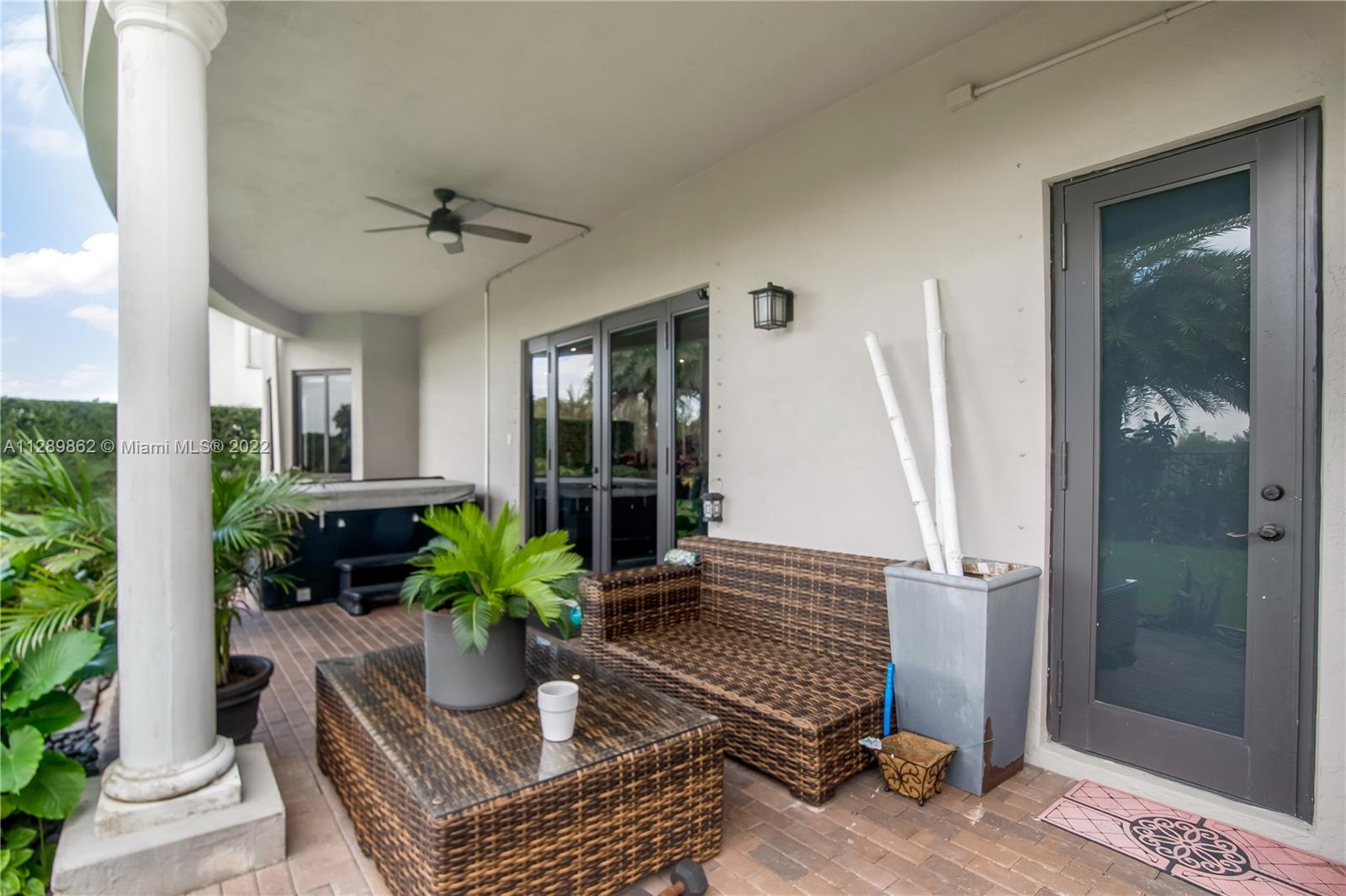 7783 Southwest 188th Street Cutler Bay, FL 33157 - Photo 35 of 70 a living room with furniture and a potted plant