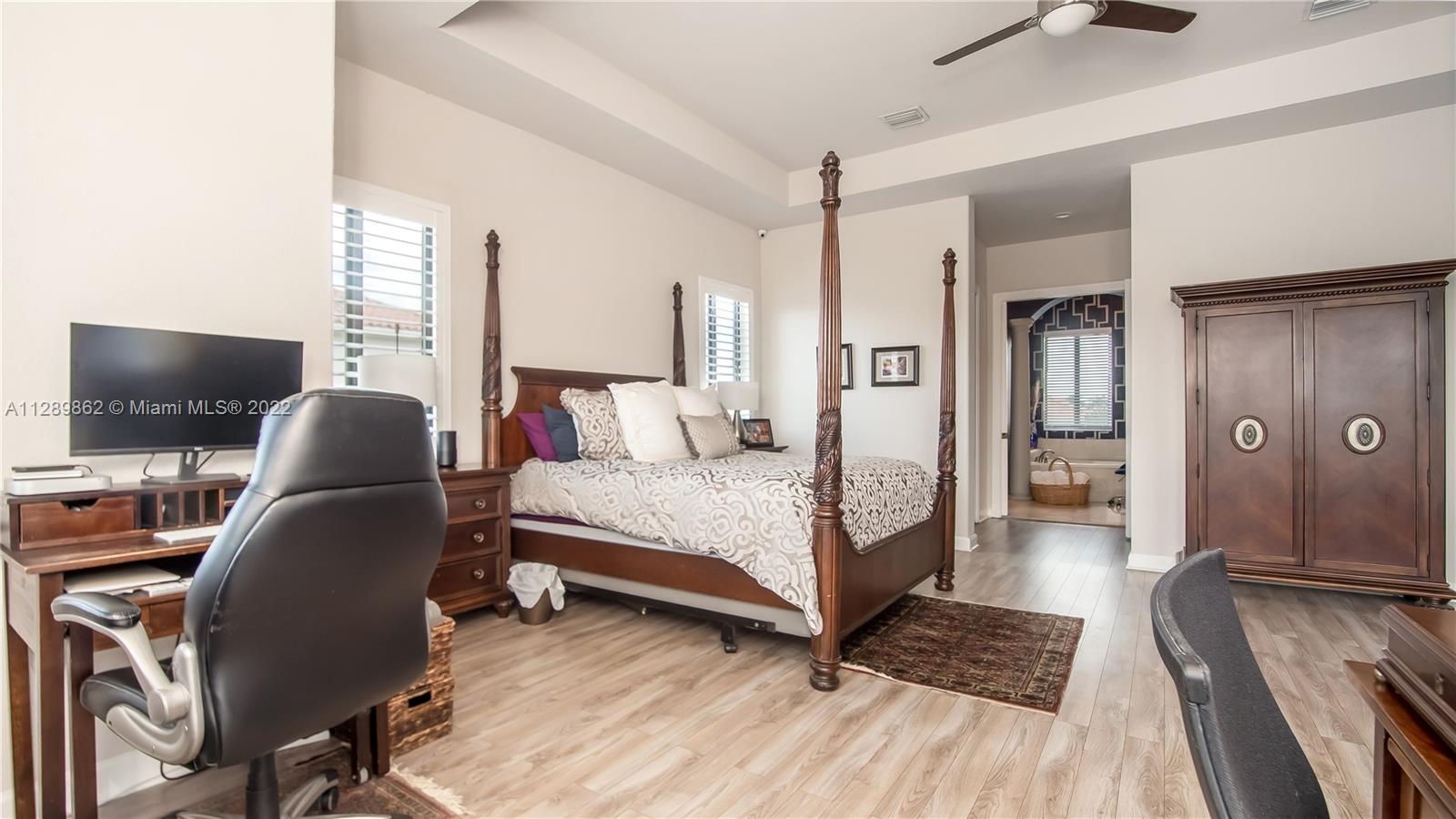 7783 Southwest 188th Street Cutler Bay, FL 33157 - Photo 38 of 70 a bedroom with a bed and a flat screen tv