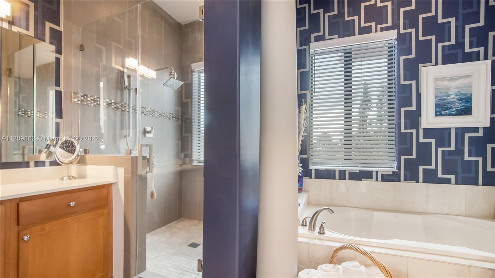 7783 Southwest 188th Street Cutler Bay, FL 33157 - Photo 42 of 70 a bathroom with a bathtub and a sink