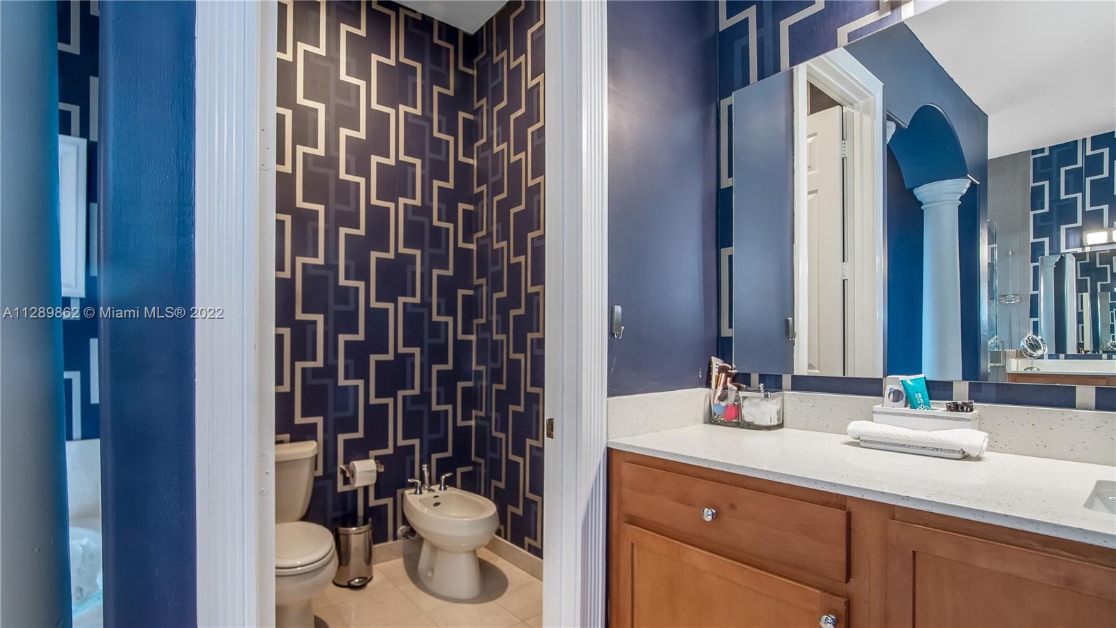 7783 Southwest 188th Street Cutler Bay, FL 33157 - Photo 43 of 70 a bathroom with a sink and a mirror