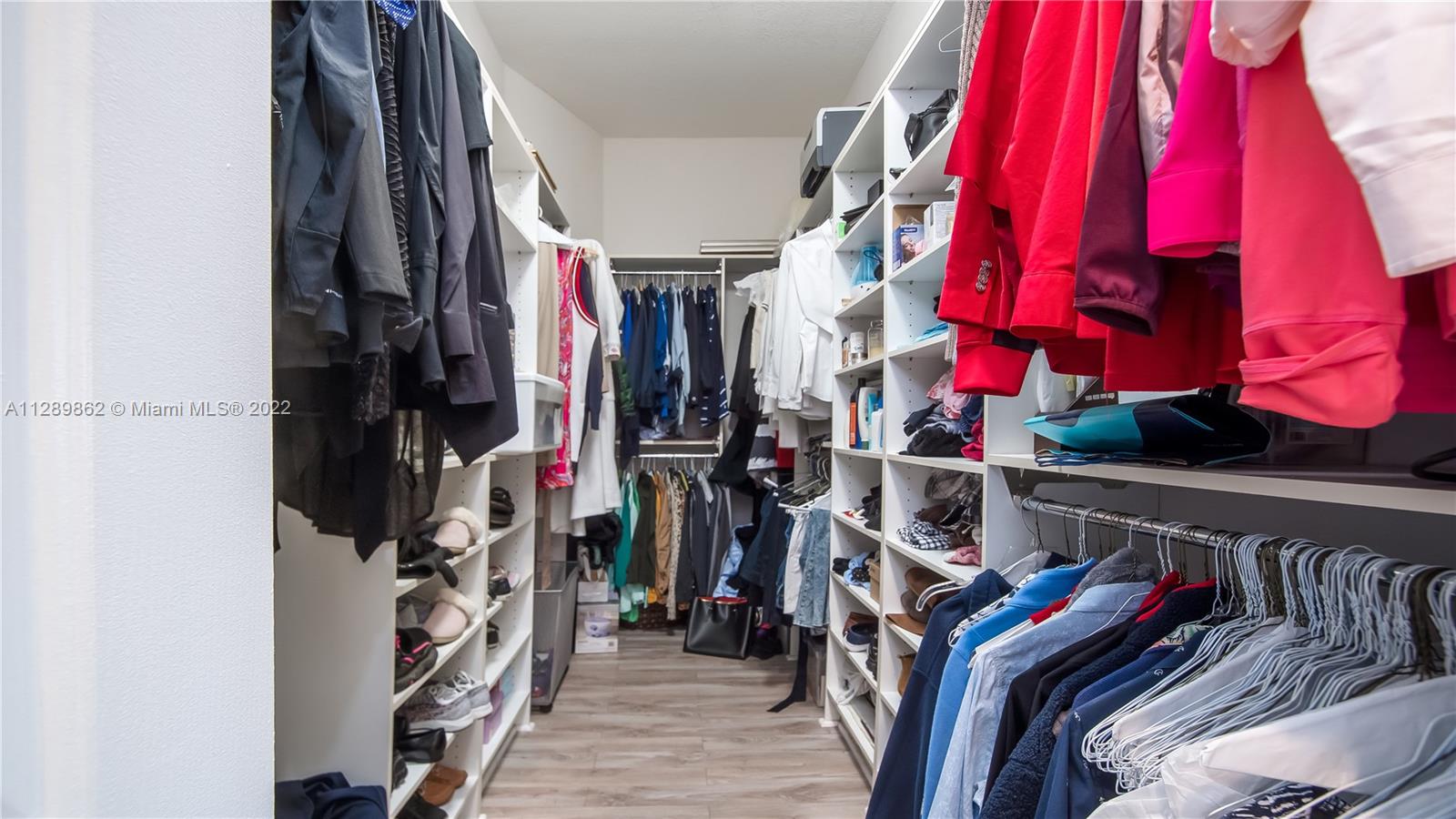 7783 Southwest 188th Street Cutler Bay, FL 33157 - Photo 46 of 70 a view of walk in closet with clothes