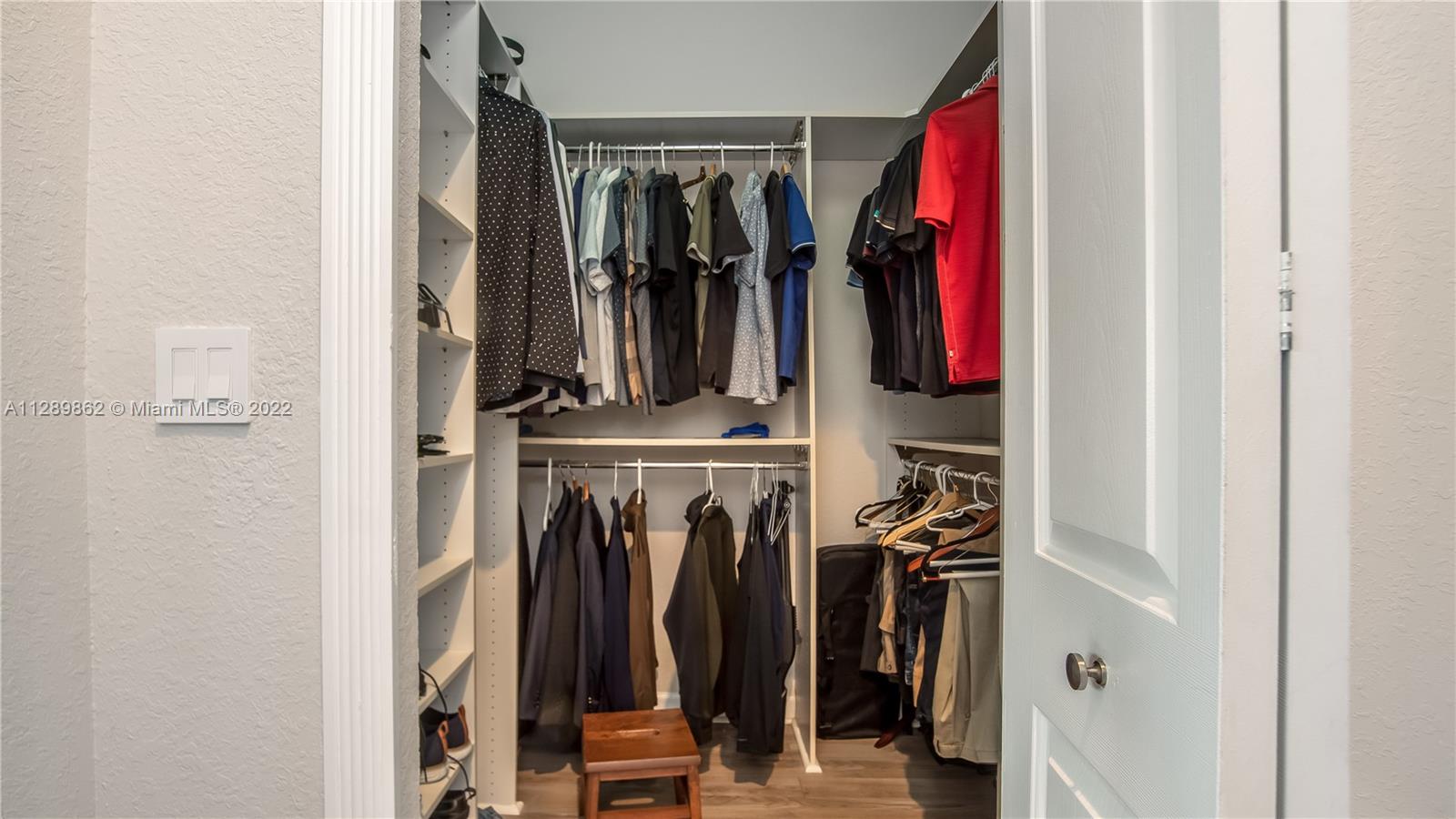 7783 Southwest 188th Street Cutler Bay, FL 33157 - Photo 47 of 70 a view of walk in closet with clothes