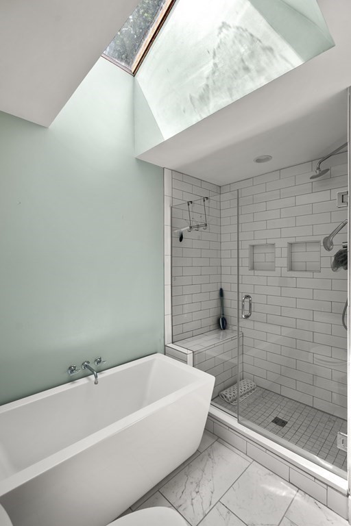 12 Higgins Road Marblehead, MA 01945 - Photo 16 of 31 a bathroom with a bathtub and shower