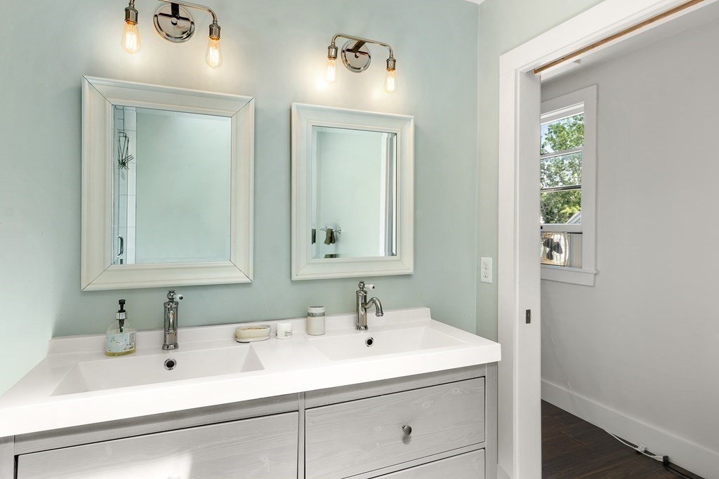 12 Higgins Road Marblehead, MA 01945 - Photo 17 of 31 a bathroom with a sink and a mirror