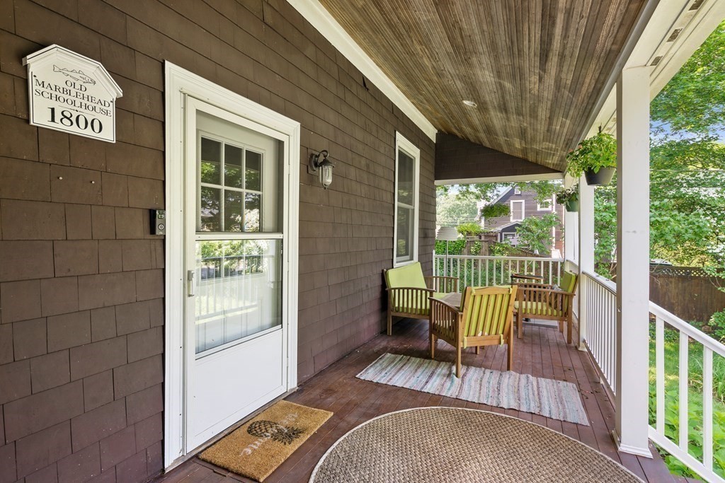 12 Higgins Road Marblehead, MA 01945 - Photo 27 of 31 a view of a porch with furniture and floor to ceiling window