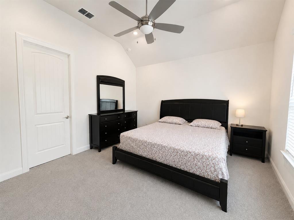 3598 Furrow Road Frisco, TX 75035 - Photo 5 of 14 a bedroom with a bed and a dresser
