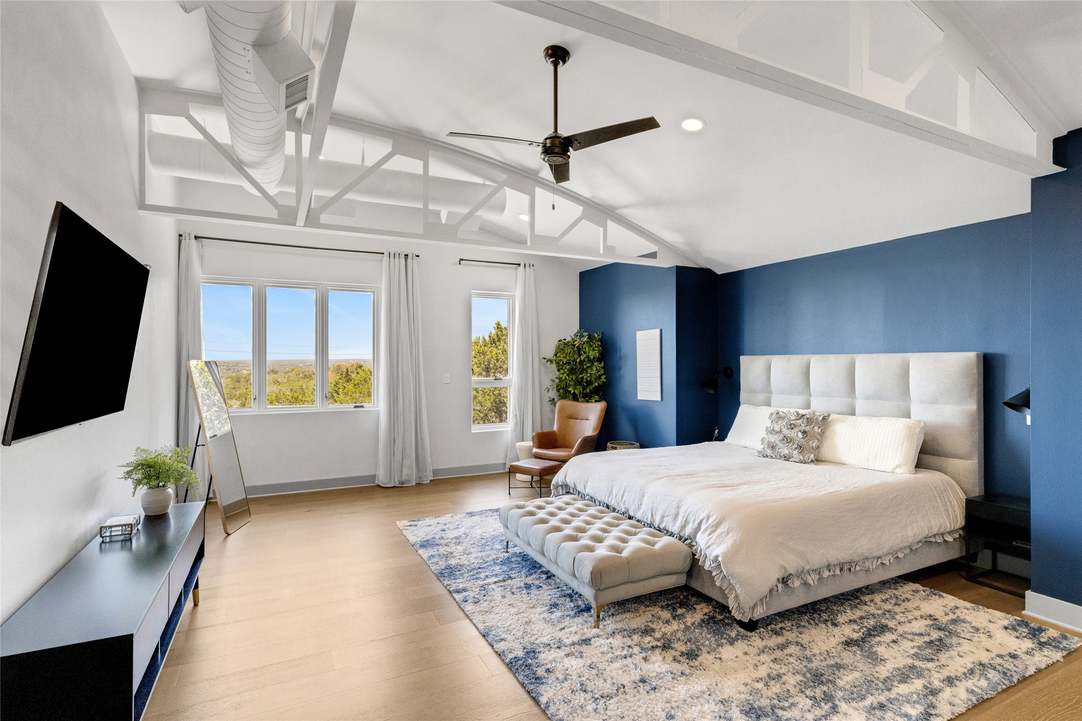 4227 Eck Lane Austin, TX 78734 - Photo 14 of 30 Bedroom with access to outside, wood finished floors, and a ceiling fan