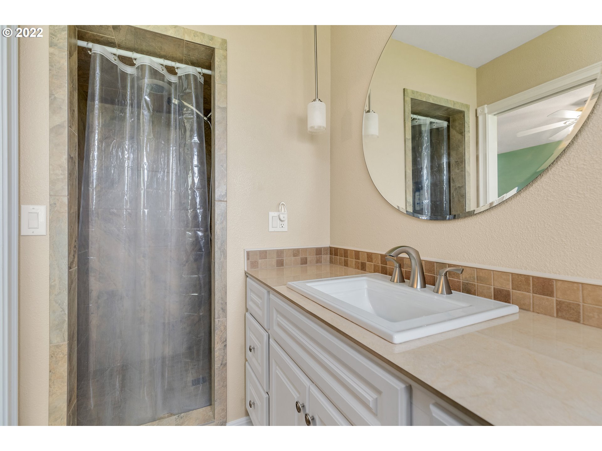 30026 Southeast Chase Road Gresham, OR 97080 - Photo 12 of 32 a bathroom with a sink and a mirror