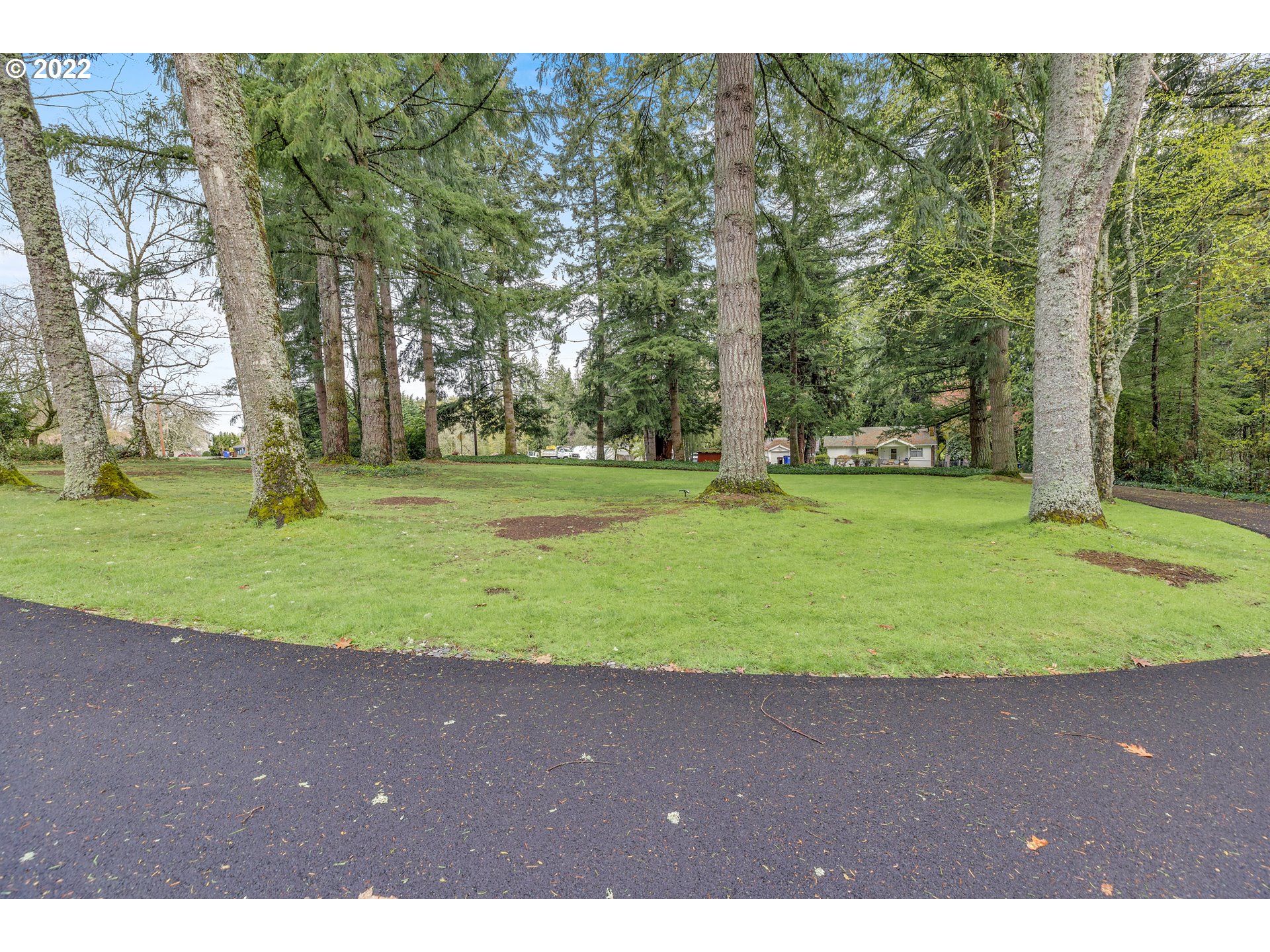 30026 Southeast Chase Road Gresham, OR 97080 - Photo 2 of 32 a view of a big yard with trees