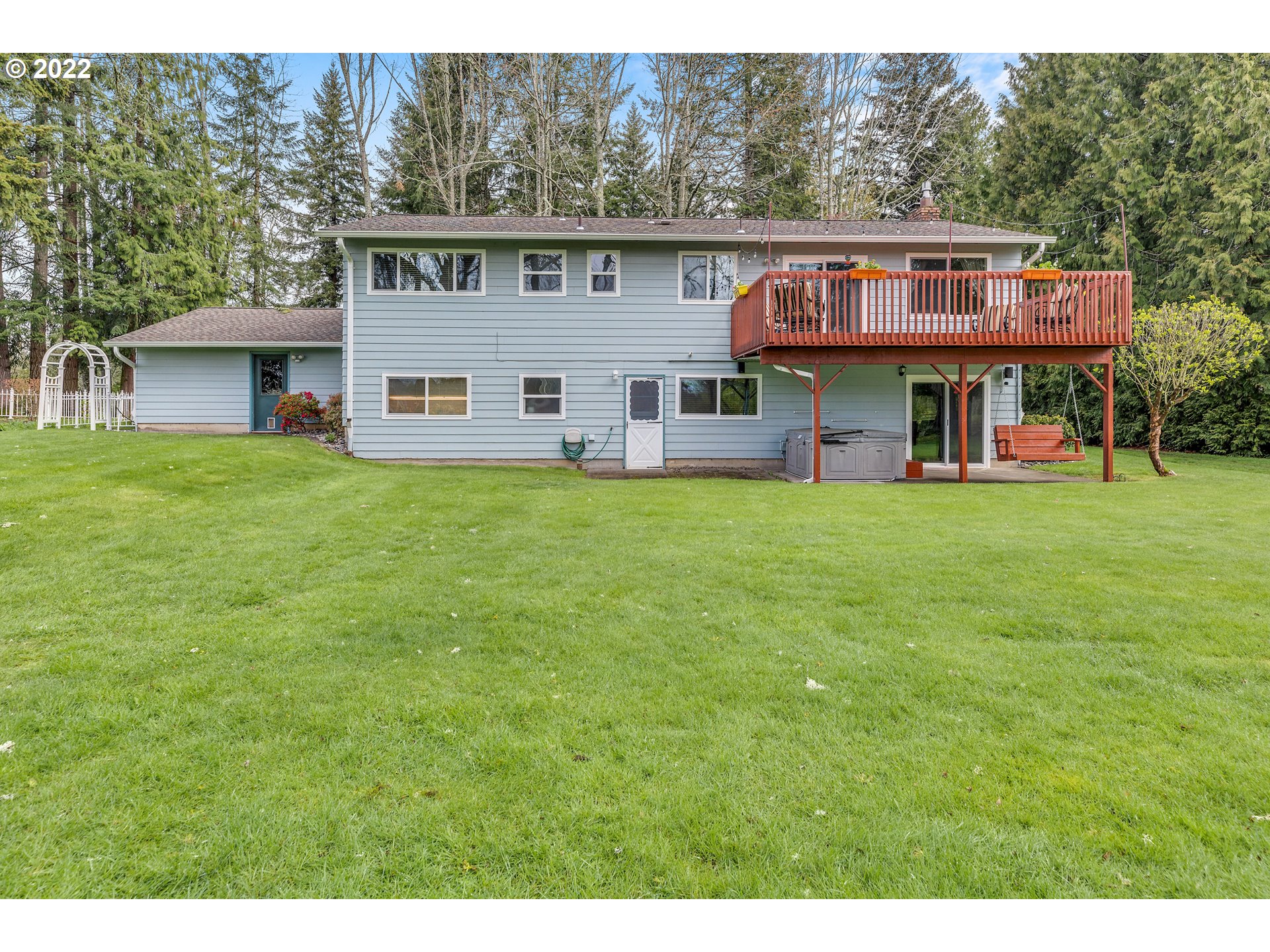 30026 Southeast Chase Road Gresham, OR 97080 - Photo 25 of 32 a view of a house with garden and deck