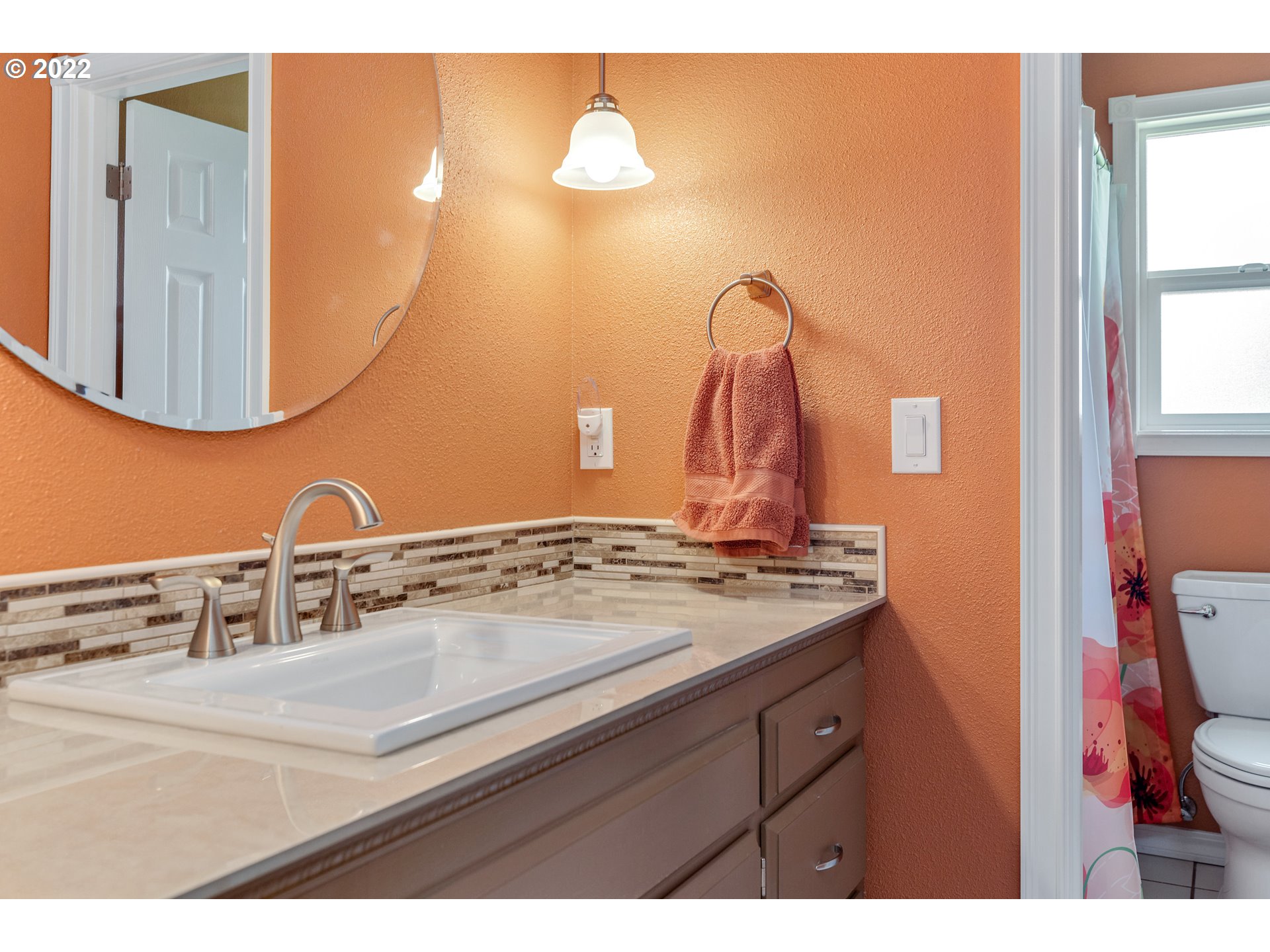 30026 Southeast Chase Road Gresham, OR 97080 - Photo 9 of 32 a bathroom with a sink and a mirror