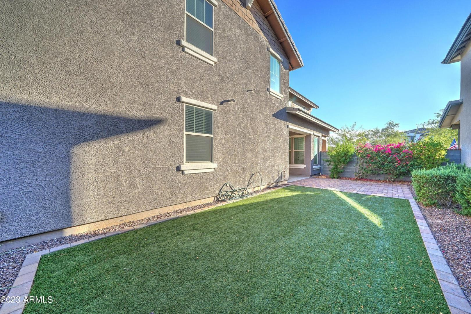 2297 North Alsap Road Buckeye, AZ 85396 - Photo 30 of 36 a front view of house with a garden