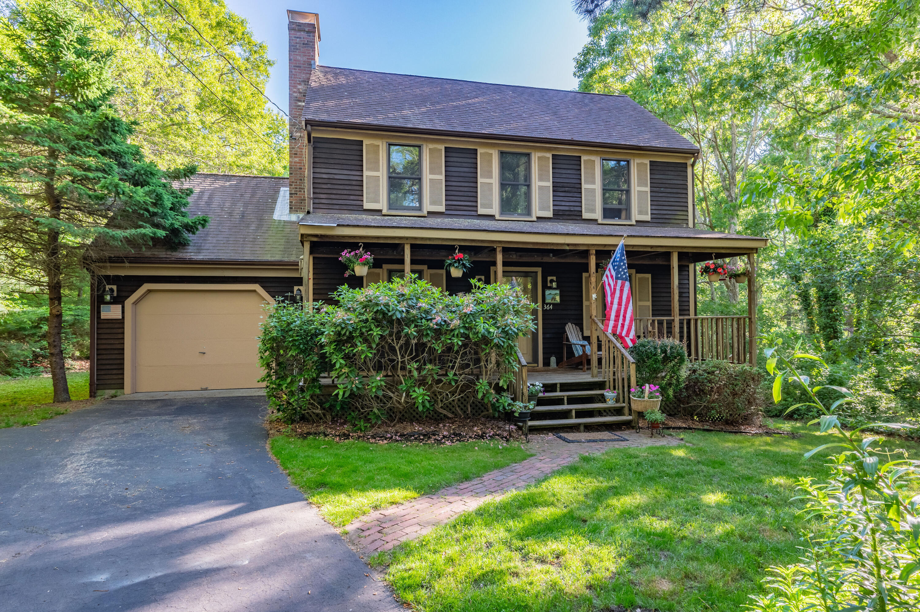 364 Jones Road Marstons Mills, MA 02648 - Photo 1 of 24 a front view of a house with a yard