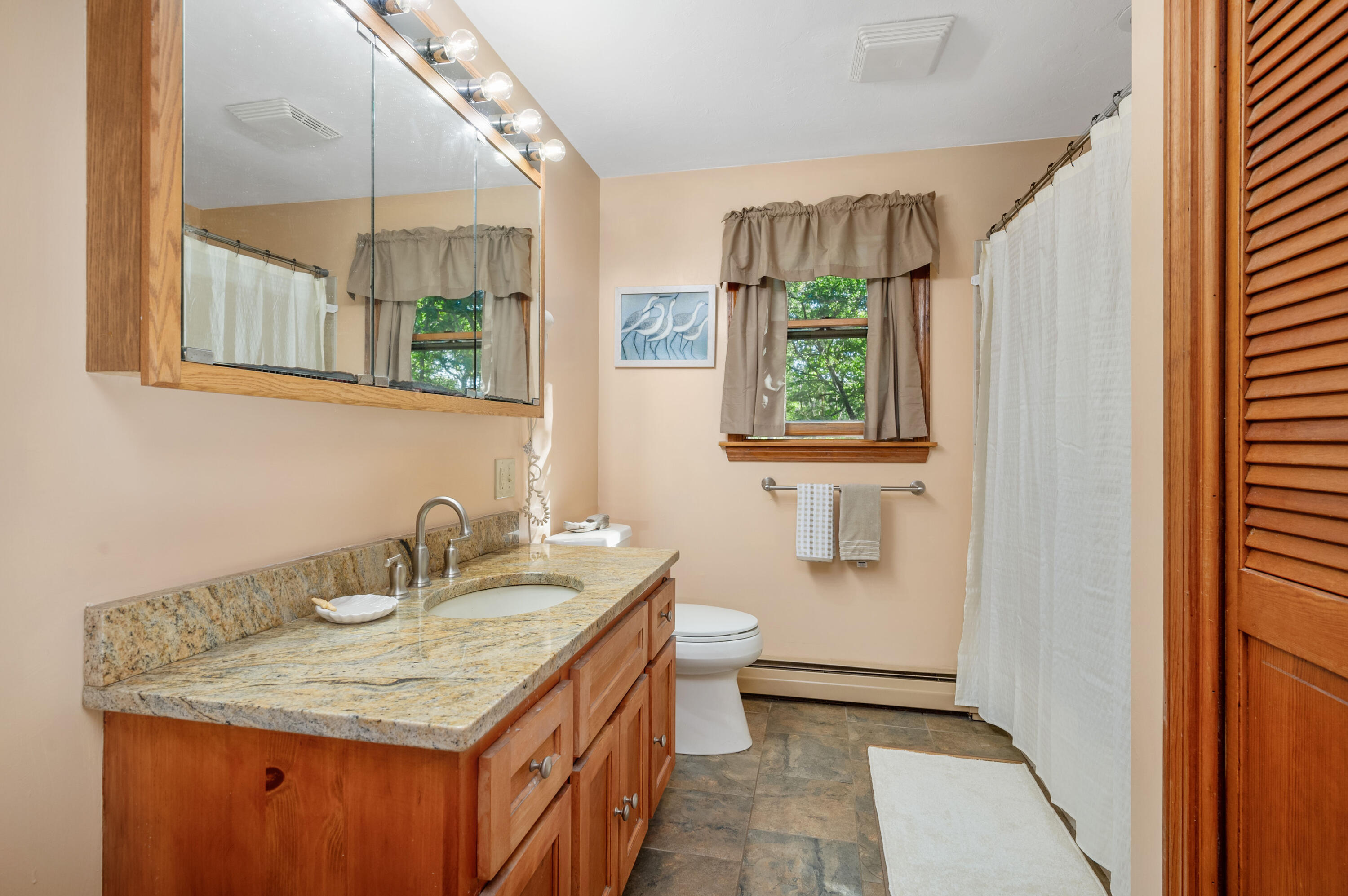 364 Jones Road Marstons Mills, MA 02648 - Photo 11 of 24 a bathroom with a sink and a mirror