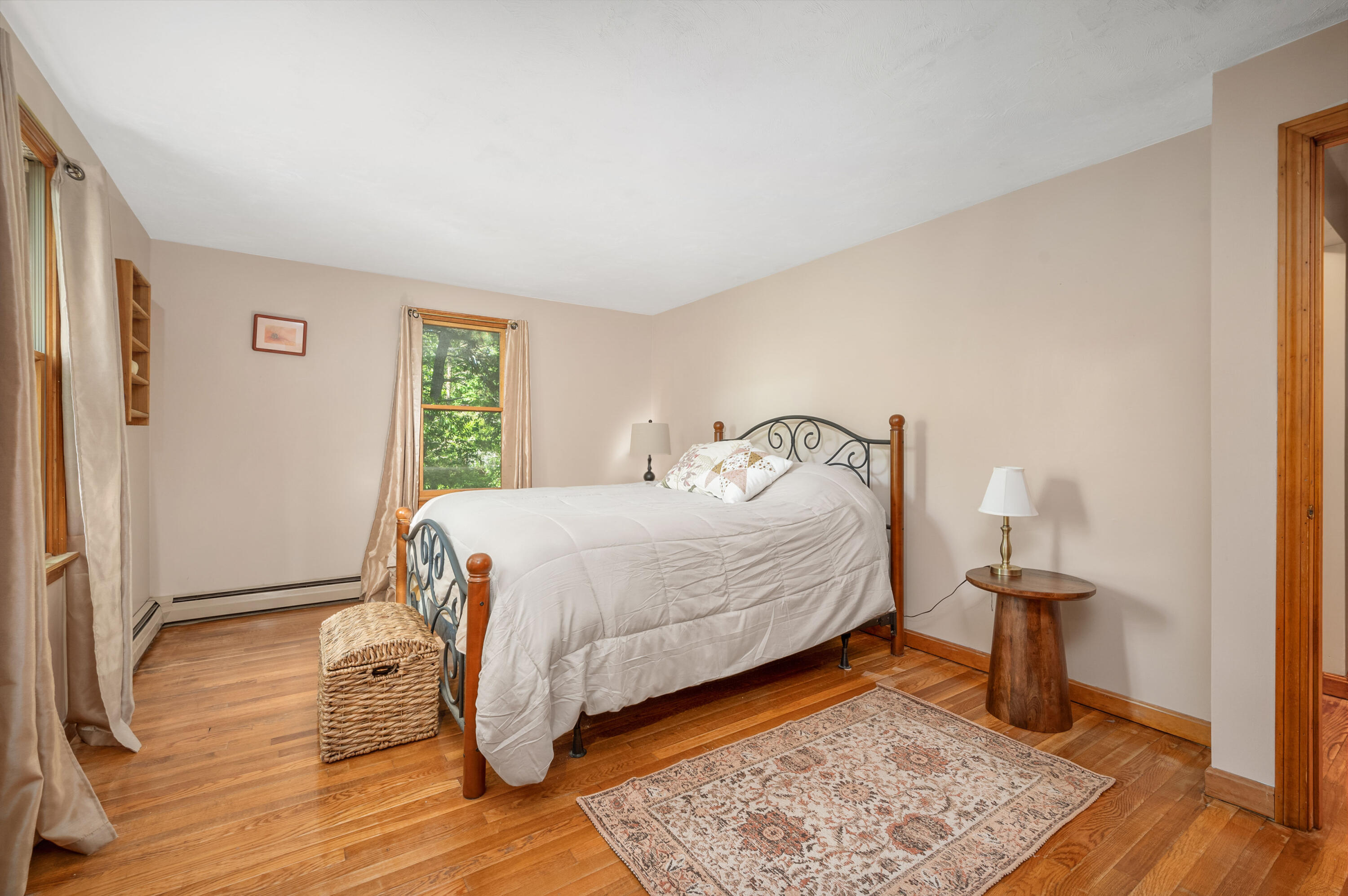 364 Jones Road Marstons Mills, MA 02648 - Photo 13 of 24 a bedroom with a bed and wooden floor