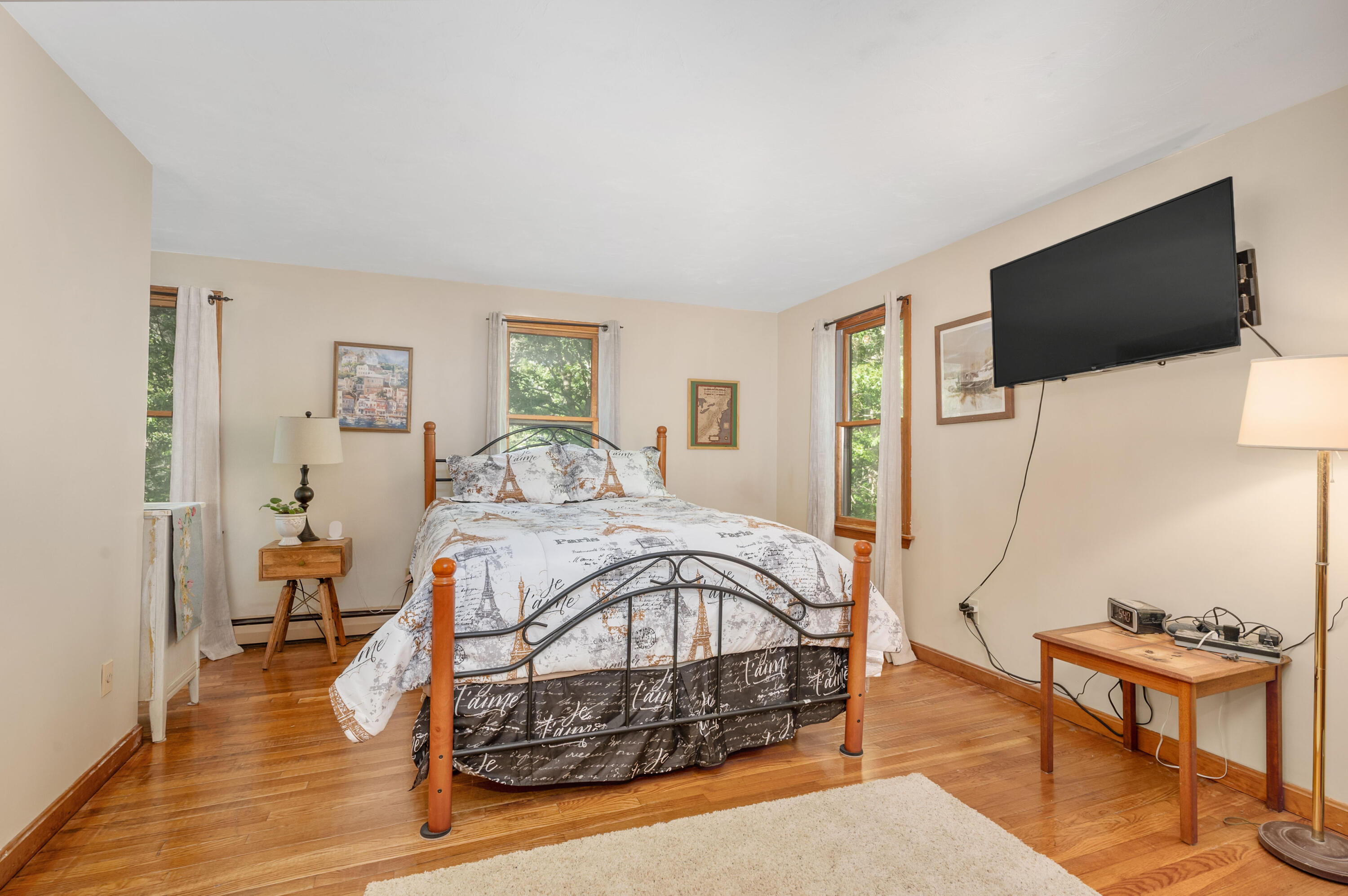 364 Jones Road Marstons Mills, MA 02648 - Photo 15 of 24 a bedroom with a bed window and a flat screen television