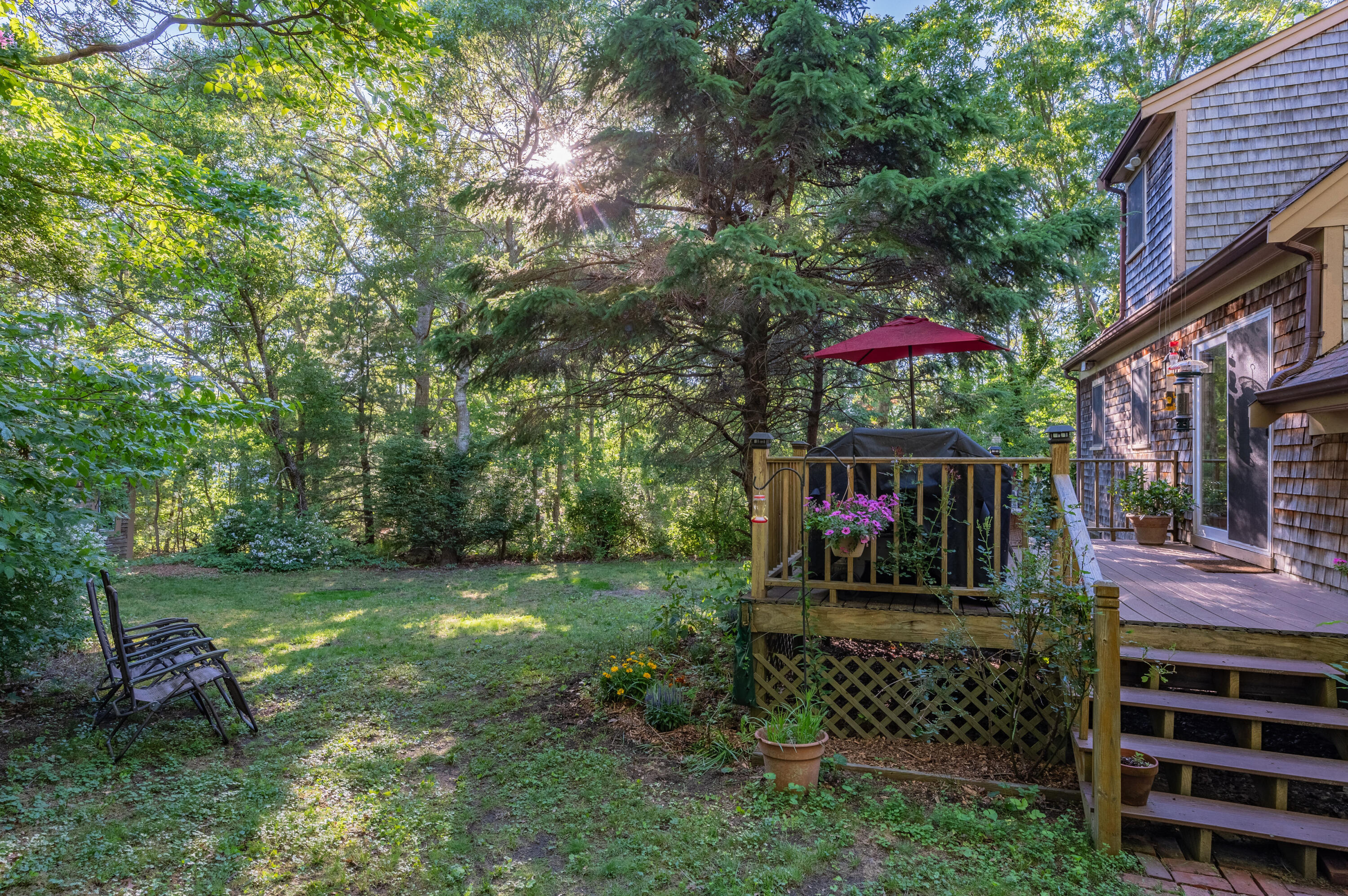 364 Jones Road Marstons Mills, MA 02648 - Photo 19 of 24 a view of a bench in a garden