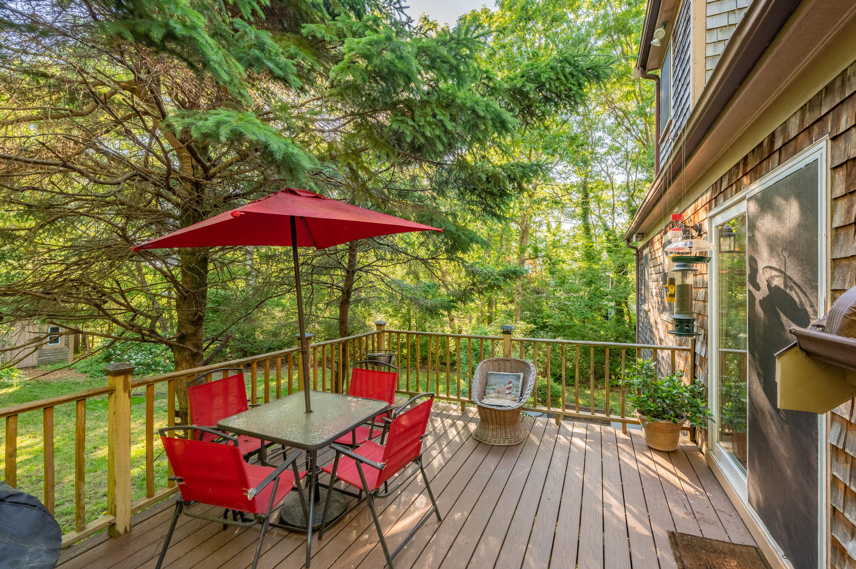 364 Jones Road Marstons Mills, MA 02648 - Photo 20 of 24 a view of a chairs and table on the wooden deck