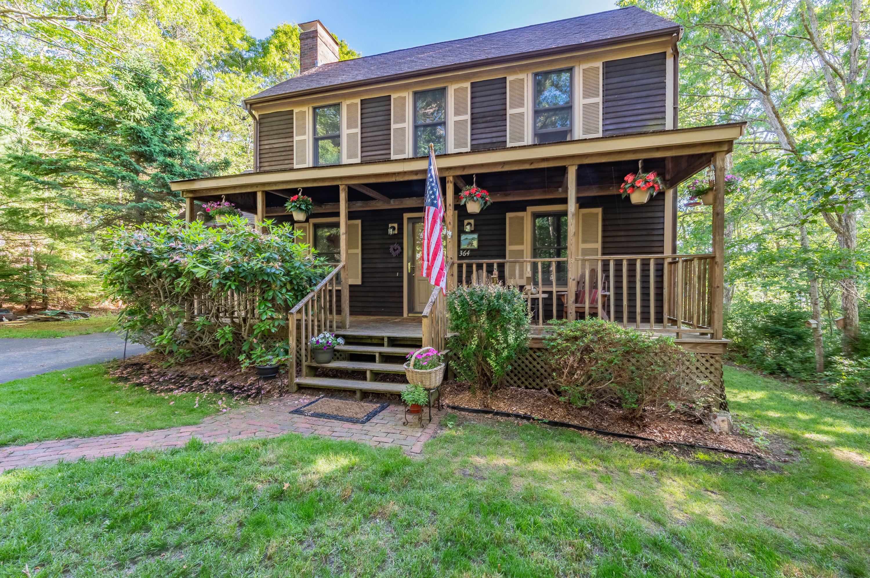 364 Jones Road Marstons Mills, MA 02648 - Photo 2 of 24 a front view of a house with garden