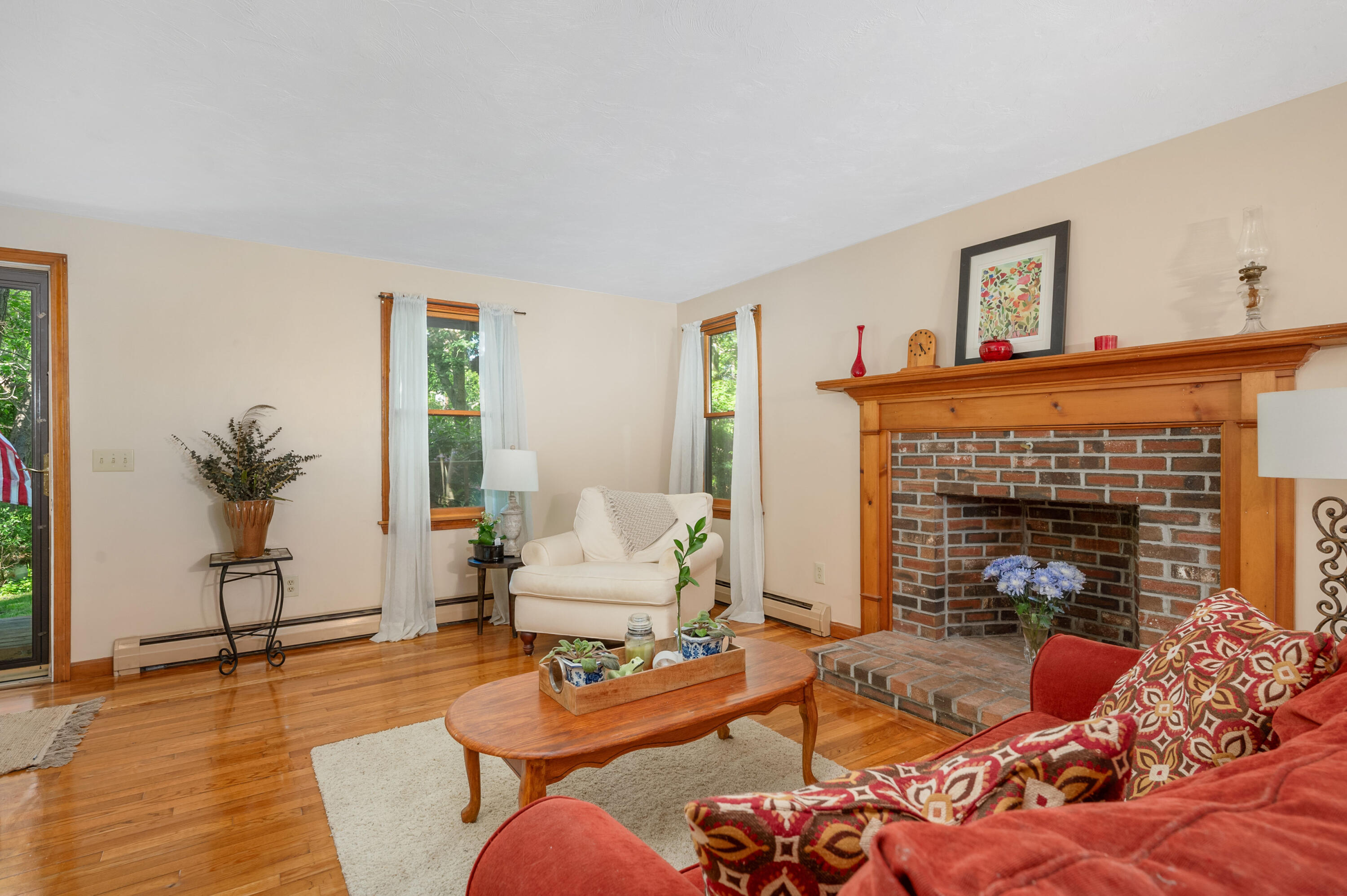 364 Jones Road Marstons Mills, MA 02648 - Photo 6 of 24 a living room with furniture and a fireplace
