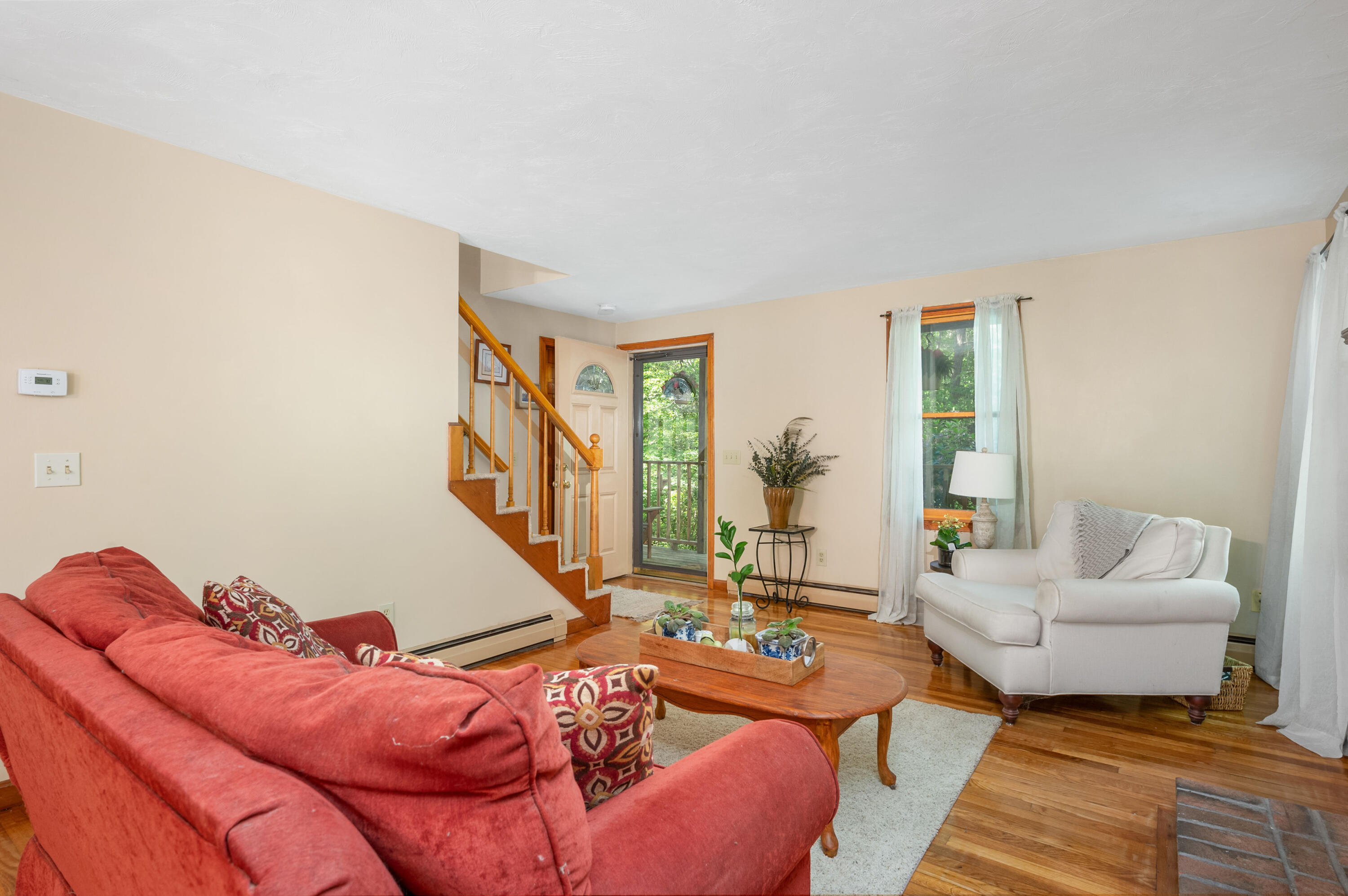 364 Jones Road Marstons Mills, MA 02648 - Photo 7 of 24 a living room with furniture and a potted plant